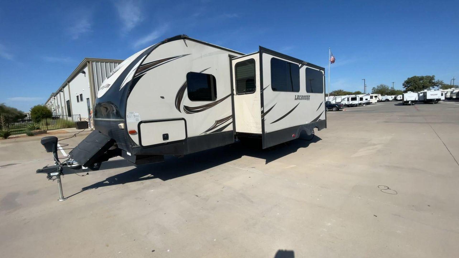 2019 TAN PRIME TIME LACROSSE 2911RB - (5ZT2LCUB3KB) , Length: 31.92 ft. | Dry Weight: 6,516 lbs. | Slides: 1 transmission, located at 4319 N Main St, Cleburne, TX, 76033, (817) 678-5133, 32.385960, -97.391212 - This 2019 LaCrosse 2911RB travel trailer measures just a bit under 32' in length. It is a dual axle, aluminum wheel setup with a dry weight of 6,516 lbs and has a carrying capacity of 3,054 lbs. This LaCrosse has one slide. The rear of the trailer holds the bathroom, which has a standalone sink and - Photo#5