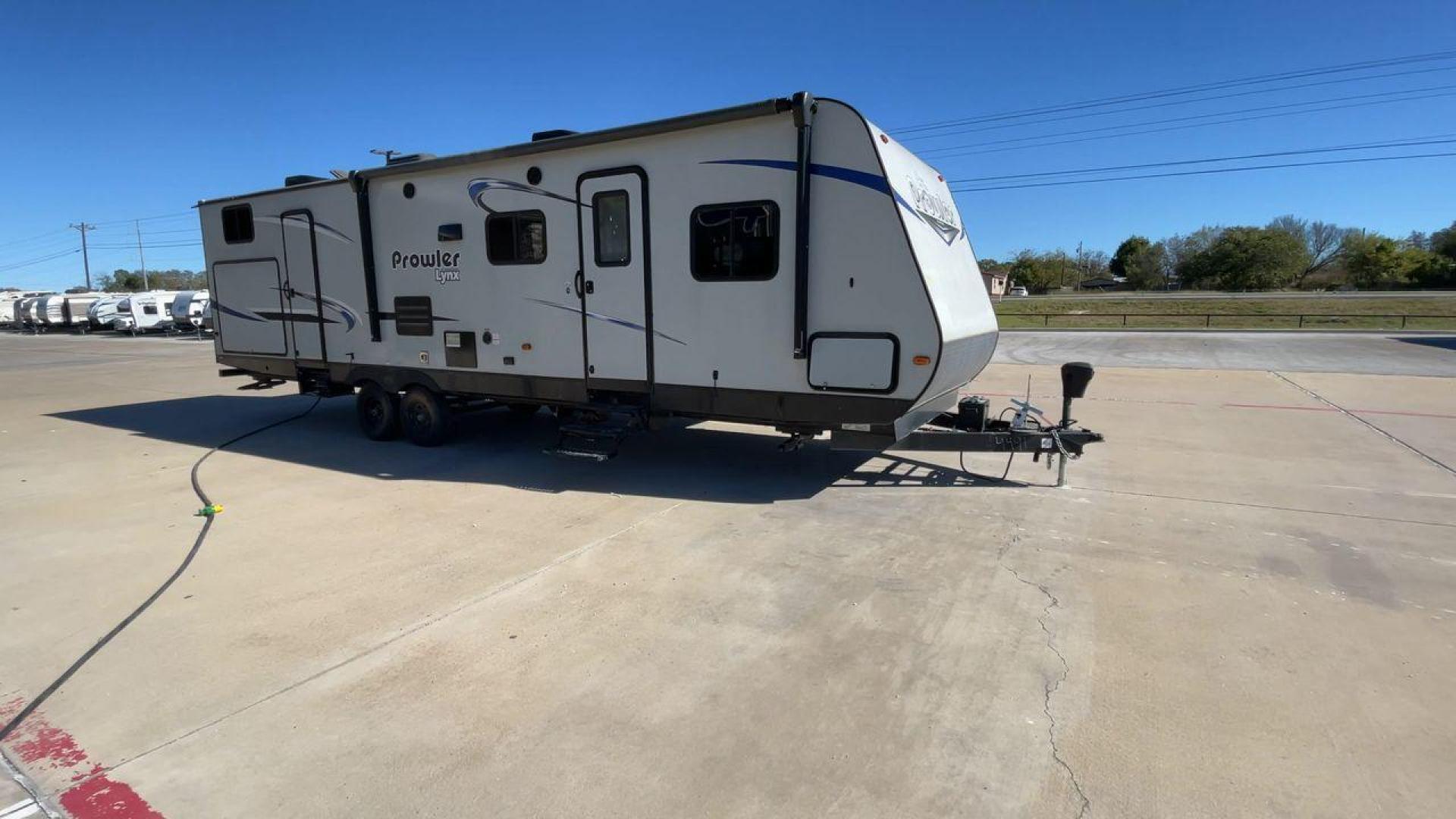 2019 GRAY PROWLER 32LX - (5SFPB3626KE) , Length: 36.33 ft. | Dry Weight: 7,540 lbs. | Slides: 2 transmission, located at 4319 N Main St, Cleburne, TX, 76033, (817) 678-5133, 32.385960, -97.391212 - This 2019 Prowler 32LX is a dual-axle steel wheel setup measuring 36.33 ft. in length and 11.17 ft. in height. It has a dry weight of 7,540 lbs. and a hitch weight of 940 lbs. It features two doors, two slides, and one awning. This travel trailer is a bunkhouse model that can sleep up to 11 peopl - Photo#3