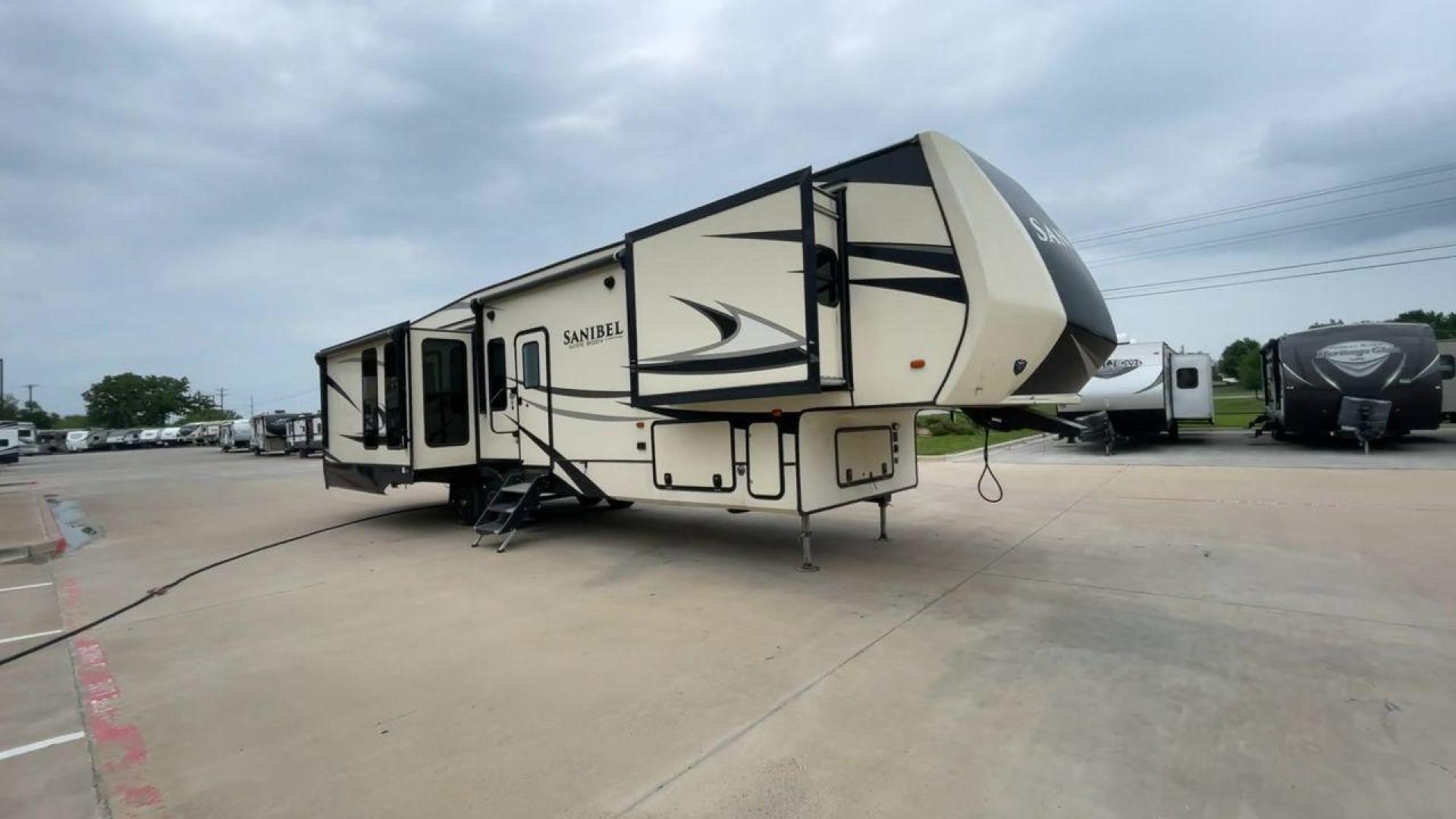 2019 TAN SANIBEL 3702WB (5ZT3SN2B6KG) , located at 4319 N Main St, Cleburne, TX, 76033, (817) 678-5133, 32.385960, -97.391212 - The length of this 2019 Sanibel Fifth Wheel is just over 41 feet, and the width is just over 8 feet. It weighs 11,859 pounds when it's not hitched and 2,298 pounds when it is. The heater in this unit is listed at 40,000 BTUs, and it heats and cools itself automatically. This has a beautiful gray bas - Photo#3