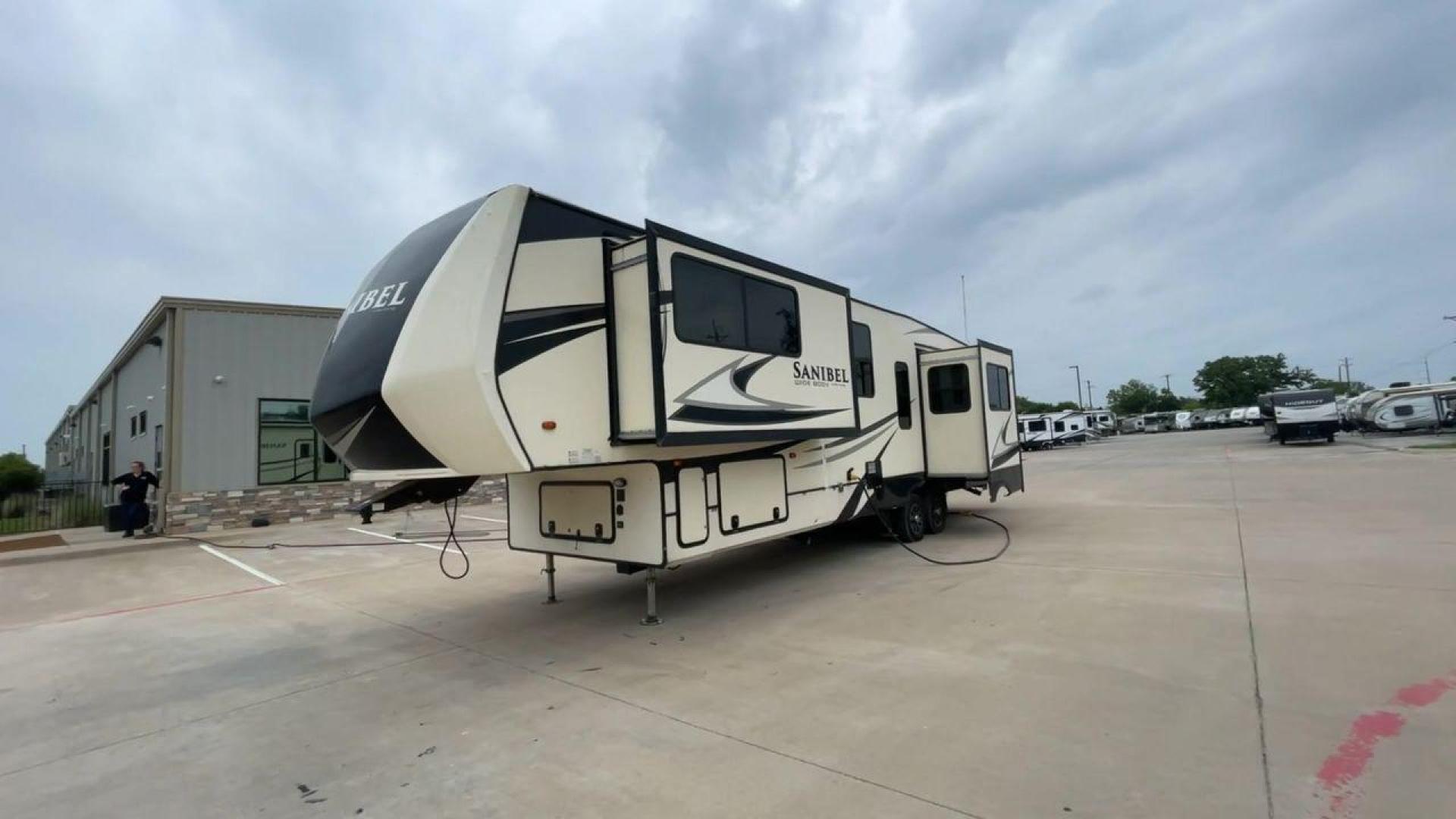 2019 TAN SANIBEL 3702WB (5ZT3SN2B6KG) , located at 4319 N Main St, Cleburne, TX, 76033, (817) 678-5133, 32.385960, -97.391212 - The length of this 2019 Sanibel Fifth Wheel is just over 41 feet, and the width is just over 8 feet. It weighs 11,859 pounds when it's not hitched and 2,298 pounds when it is. The heater in this unit is listed at 40,000 BTUs, and it heats and cools itself automatically. This has a beautiful gray bas - Photo#5