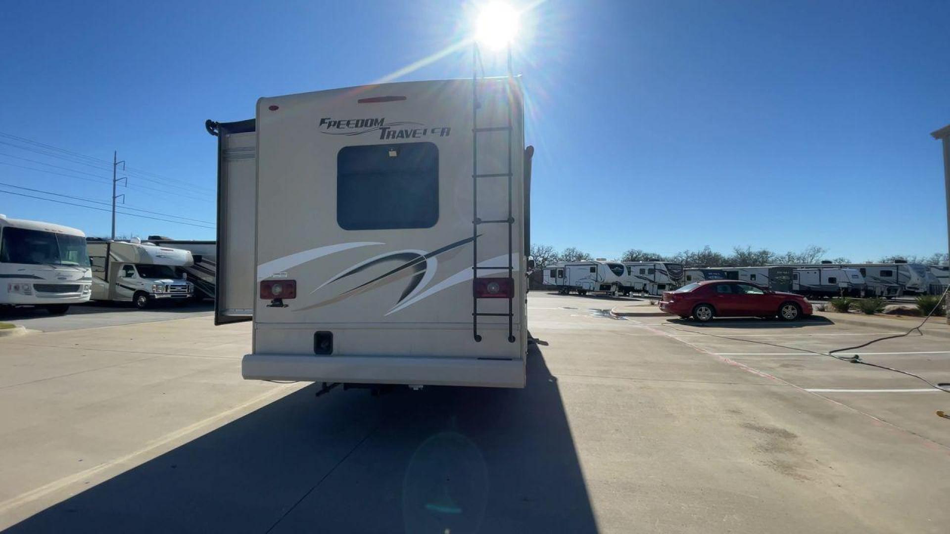 2019 THOR FREEDOM TRAVELER A30 (1F65F5DY1K0) , Length:31.75 ft. | Gross Weight: 18,000 lbs. | Slides: 1 transmission, located at 4319 N Main St, Cleburne, TX, 76033, (817) 678-5133, 32.385960, -97.391212 - The 2019 Thor Freedom Traveler A30 is a sleek and modern travel trailer with an attractive beige exterior enhanced by dynamic swirls of gold, black, and white accents. Its single slide-out provides extra interior space when parked. The coach features large, tinted windows for ample natural light whi - Photo#8