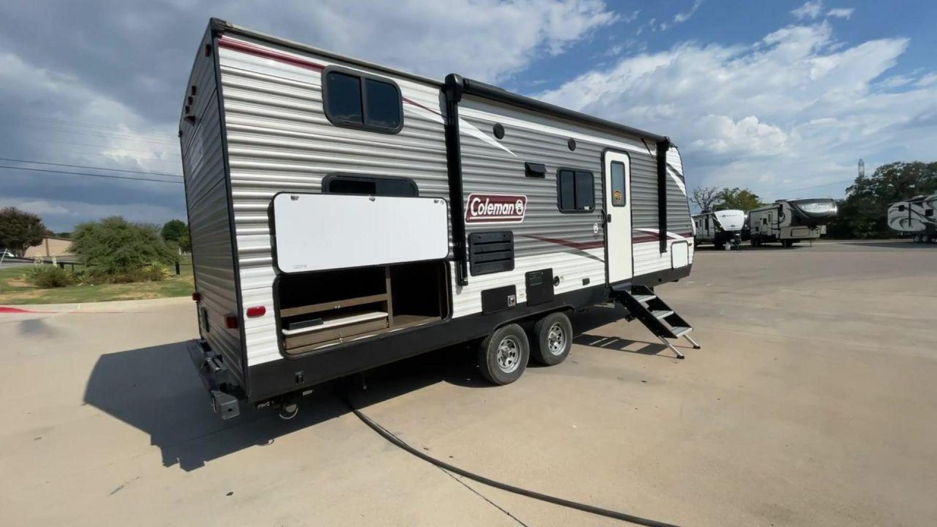 2020 DUTCHMEN COLEMAN 244BH (4YDT24426LH) , Length: 27.58 ft. | Dry Weight: 5,541 lbs. | Slides: 1 transmission, located at 4319 N Main St, Cleburne, TX, 76033, (817) 678-5133, 32.385960, -97.391212 - The 2020 Dutchmen Coleman 244BH travel trailer offers a sleek and sturdy exterior design, making it perfect for both seasoned travelers and families seeking adventure. The front of the trailer features the iconic Coleman logo prominently displayed on its silver and white aluminum exterior. At 27.58 - Photo#0