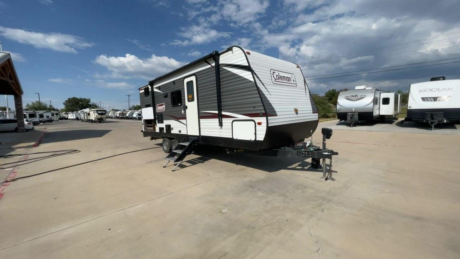 2020 DUTCHMEN COLEMAN 244BH (4YDT24426LH) , Length: 27.58 ft. | Dry Weight: 5,541 lbs. | Slides: 1 transmission, located at 4319 N Main St, Cleburne, TX, 76033, (817) 678-5133, 32.385960, -97.391212 - The 2020 Dutchmen Coleman 244BH travel trailer offers a sleek and sturdy exterior design, making it perfect for both seasoned travelers and families seeking adventure. The front of the trailer features the iconic Coleman logo prominently displayed on its silver and white aluminum exterior. At 27.58 - Photo#2