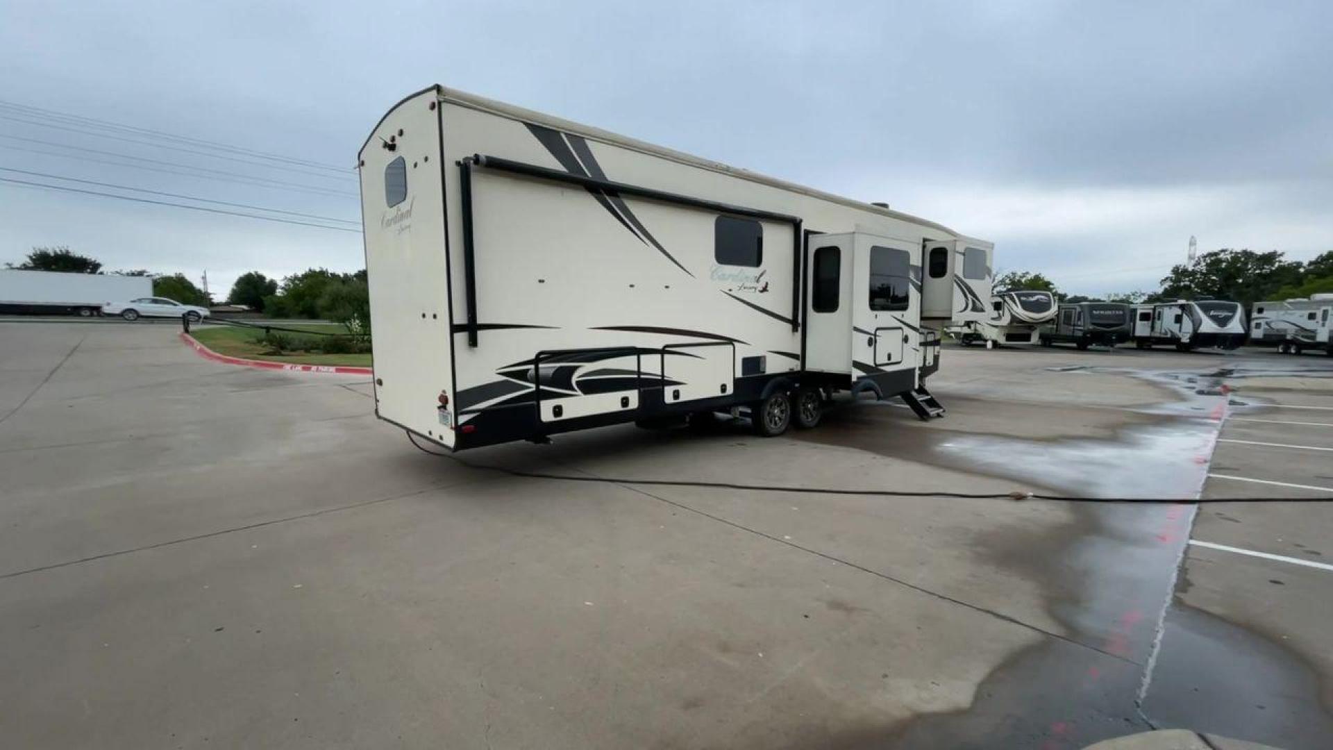 2020 FOREST RIVER CARDINAL 3700FLX (4X4FCAN21LG) , Length: 41.8 ft | Dry Weight: 13,516 lbs | Gross Weight: 16,550 lbs | Slides: 5 transmission, located at 4319 N Main St, Cleburne, TX, 76033, (817) 678-5133, 32.385960, -97.391212 - The 2020 Forest River Cardinal 3700FLX is the ultimate in luxury and comfort. It is a fifth-wheel RV that was intended to be both beautiful and useful. Its elegant front living area has premium theater seats, a fireplace, and a TV that can be pulled out of the wall, making it a great place to relax - Photo#1