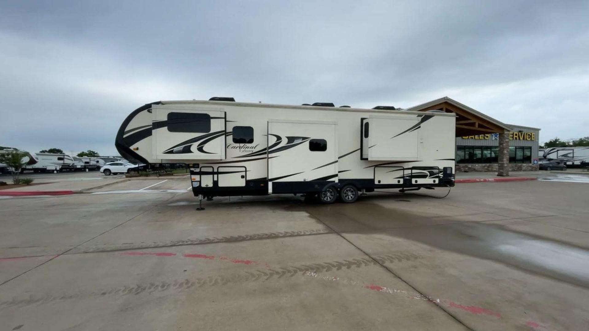 2020 FOREST RIVER CARDINAL 3700FLX (4X4FCAN21LG) , Length: 41.8 ft | Dry Weight: 13,516 lbs | Gross Weight: 16,550 lbs | Slides: 5 transmission, located at 4319 N Main St, Cleburne, TX, 76033, (817) 678-5133, 32.385960, -97.391212 - The 2020 Forest River Cardinal 3700FLX is the ultimate in luxury and comfort. It is a fifth-wheel RV that was intended to be both beautiful and useful. Its elegant front living area has premium theater seats, a fireplace, and a TV that can be pulled out of the wall, making it a great place to relax - Photo#6