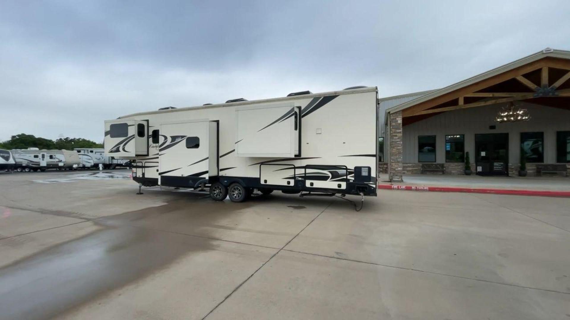 2020 FOREST RIVER CARDINAL 3700FLX (4X4FCAN21LG) , Length: 41.8 ft | Dry Weight: 13,516 lbs | Gross Weight: 16,550 lbs | Slides: 5 transmission, located at 4319 N Main St, Cleburne, TX, 76033, (817) 678-5133, 32.385960, -97.391212 - The 2020 Forest River Cardinal 3700FLX is the ultimate in luxury and comfort. It is a fifth-wheel RV that was intended to be both beautiful and useful. Its elegant front living area has premium theater seats, a fireplace, and a TV that can be pulled out of the wall, making it a great place to relax - Photo#7