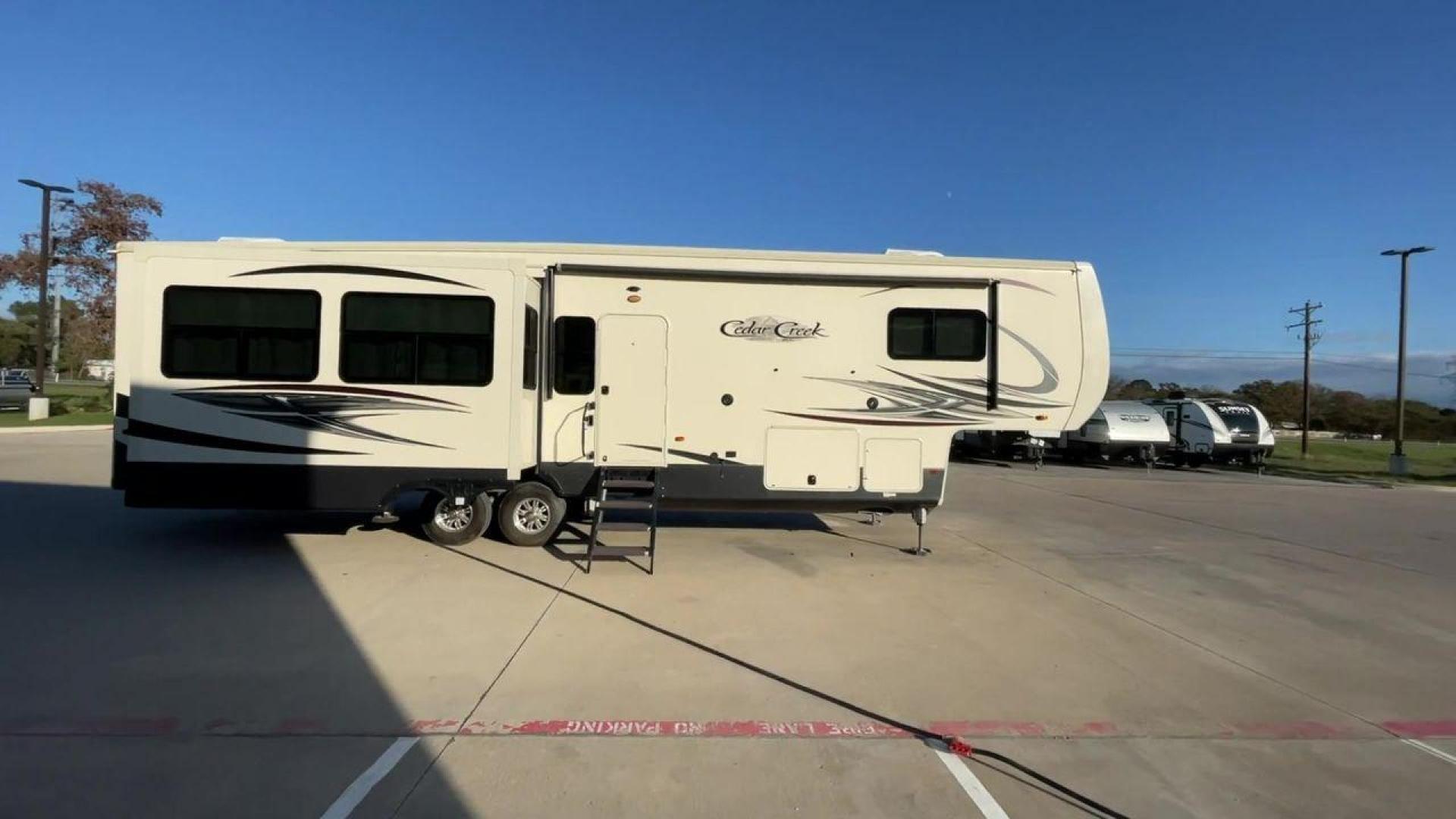 2020 TAN FOREST RIVER CEDAR CREEK HATHAWAY (4X4FCRM28LS) , Length: 38.83 ft. | Dry Weight: 13,134 lbs. | Gross Weight: 16,525 lbs. | Slides: 3 transmission, located at 4319 N Main St, Cleburne, TX, 76033, (817) 678-5133, 32.385960, -97.391212 - This 2020 Cedar Creek Hathaway 36CK2 fifth wheel has a length of 38.83 ft, a width of 8 ft, and a height of 13.42 ft. This fifth wheel has a dry weight of 13,134 lbs and a payload capacity of 3,391. The GVWR is 16,525 lbs and has a hitch weight of 2,525 lbs. The Cedar Creek has a true gel coat finis - Photo#2