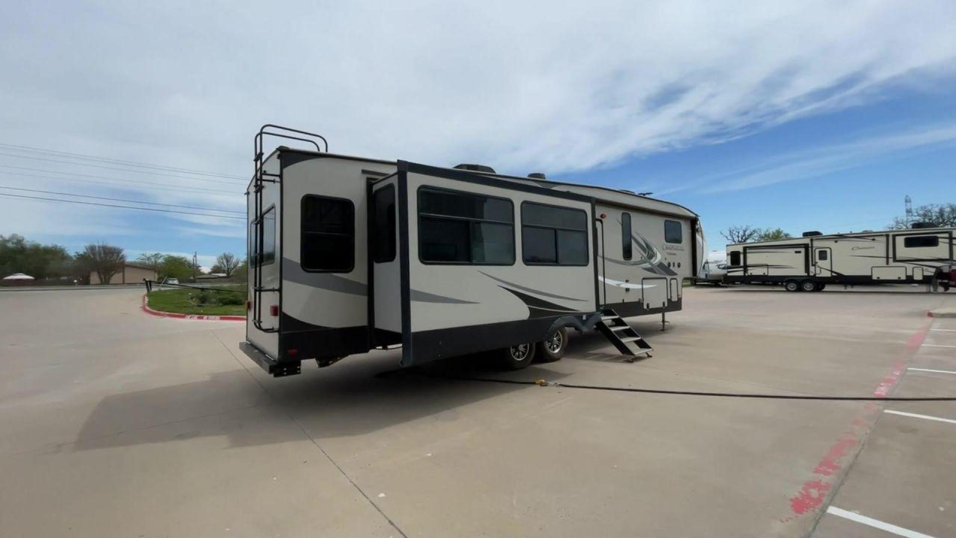 2020 FOREST RIVER CHAPARRAL 360IBL (5ZT3CH1B1LA) , Length: 39 ft. | Dry Weight: 11,450 lbs. | Gross Weight: 14,000 lbs. | Slides: 4 transmission, located at 4319 N Main St, Cleburne, TX, 76033, (817) 678-5133, 32.385960, -97.391212 - With a length of 39 feet and a dry weight of 11,450 pounds, this spacious 2020 Coachmen Chaparral 360IBL offers plenty of room for the whole family and then some. The exterior is equipped with a massive 18-foot power awning, providing ample shade and protection from the elements while you relax outs - Photo#1