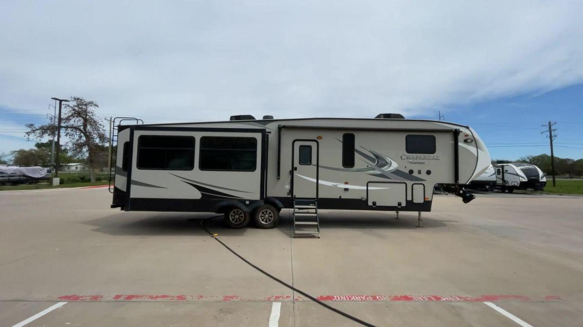 2020 FOREST RIVER CHAPARRAL 360IBL (5ZT3CH1B1LA) , Length: 39 ft. | Dry Weight: 11,450 lbs. | Gross Weight: 14,000 lbs. | Slides: 4 transmission, located at 4319 N Main St, Cleburne, TX, 76033, (817) 678-5133, 32.385960, -97.391212 - With a length of 39 feet and a dry weight of 11,450 pounds, this spacious 2020 Coachmen Chaparral 360IBL offers plenty of room for the whole family and then some. The exterior is equipped with a massive 18-foot power awning, providing ample shade and protection from the elements while you relax outs - Photo#2