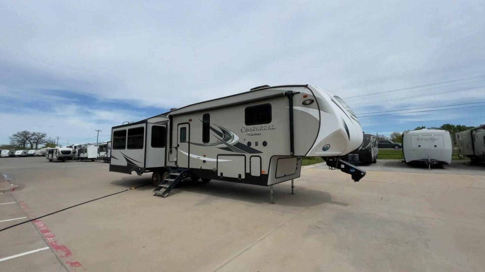 2020 FOREST RIVER CHAPARRAL 360IBL (5ZT3CH1B1LA) , Length: 39 ft. | Dry Weight: 11,450 lbs. | Gross Weight: 14,000 lbs. | Slides: 4 transmission, located at 4319 N Main St, Cleburne, TX, 76033, (817) 678-5133, 32.385960, -97.391212 - With a length of 39 feet and a dry weight of 11,450 pounds, this spacious 2020 Coachmen Chaparral 360IBL offers plenty of room for the whole family and then some. The exterior is equipped with a massive 18-foot power awning, providing ample shade and protection from the elements while you relax outs - Photo#3