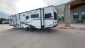 2020 FOREST RIVER FREEDOM EXPRESS (5ZT2FEXBXLW) , Length: 36.92 ft | Dry Weight: 8,328 lbs | Gross Weight: 10,500 lbs | Slides: 3 transmission, located at 4319 N Main St, Cleburne, TX, 76033, (817) 678-5133, 32.385960, -97.391212 - The 2020 Freedom Express 324RLDS has a white body accented with sleek black and blue graphics, creating a stylish look. The front cap features an aerodynamic shape with bold design lines and a large tinted window. A sturdy electric tongue jack is positioned at the hitch for easy adjustments, complem - Photo#7