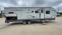 2020 WHITE GULFSTREAM TRAILMASTER 301TB (1NL1G3425L1) , Length: 34.08 ft. | Dry Weight: 6,845 lbs. | Slides: 1 transmission, located at 4319 N Main St, Cleburne, TX, 76033, (817) 678-5133, 32.385960, -97.391212 - This 2020 Gulf Stream Trailmaster 301TB travel trailer measures 34.01 feet. There are two axles with steel wheels and electric drum brakes. Its dry weight is 6,845 lbs, its payload is 2,840 lbs, and its hitch is 885 lbs. The aluminum walls are painted gray with white and dark gray graphics. The 13,5 - Photo#2