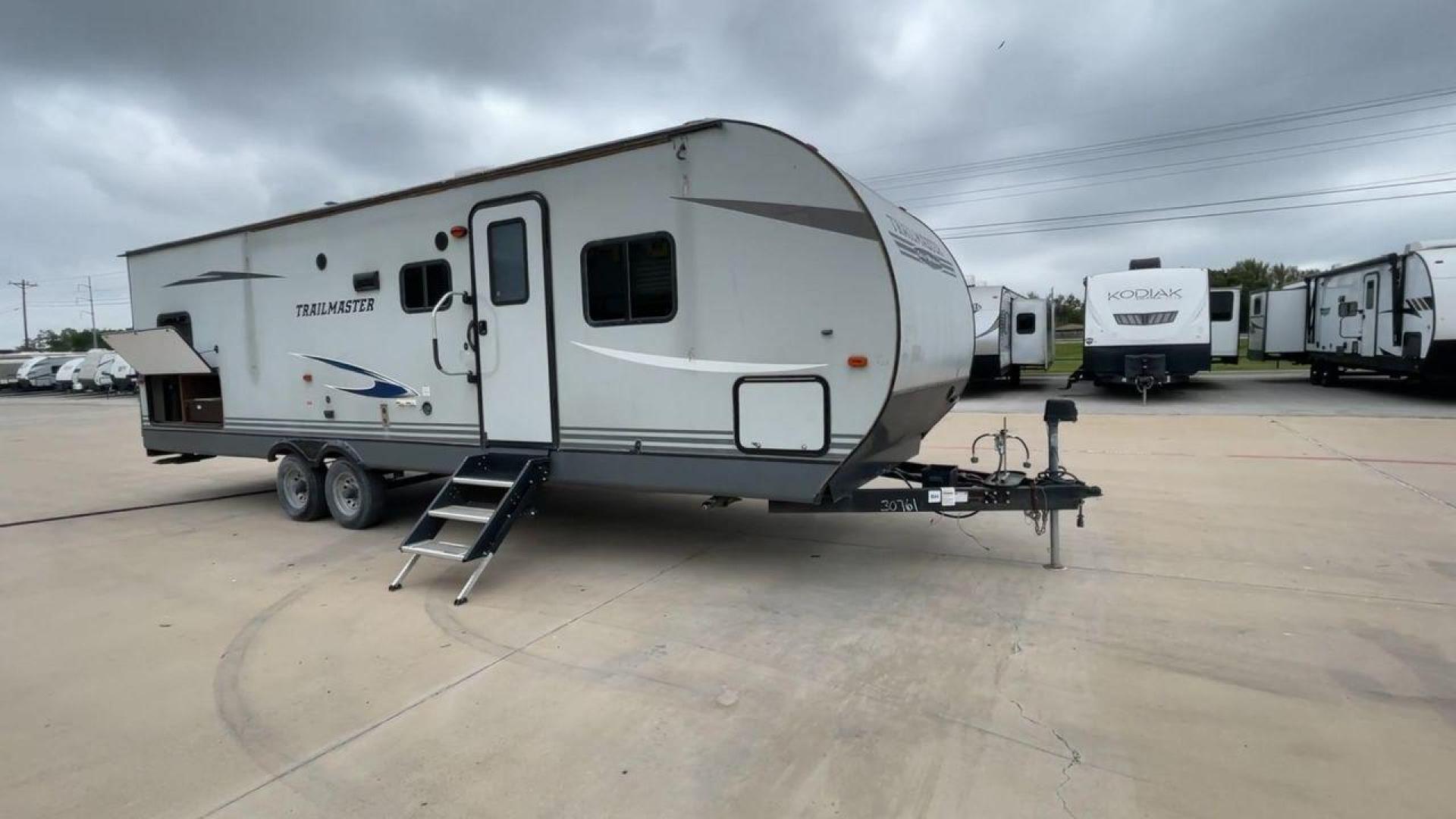 2020 WHITE GULFSTREAM TRAILMASTER 301TB (1NL1G3425L1) , Length: 34.08 ft. | Dry Weight: 6,845 lbs. | Slides: 1 transmission, located at 4319 N Main St, Cleburne, TX, 76033, (817) 678-5133, 32.385960, -97.391212 - This 2020 Gulf Stream Trailmaster 301TB travel trailer measures 34.01 feet. There are two axles with steel wheels and electric drum brakes. Its dry weight is 6,845 lbs, its payload is 2,840 lbs, and its hitch is 885 lbs. The aluminum walls are painted gray with white and dark gray graphics. The 13,5 - Photo#3