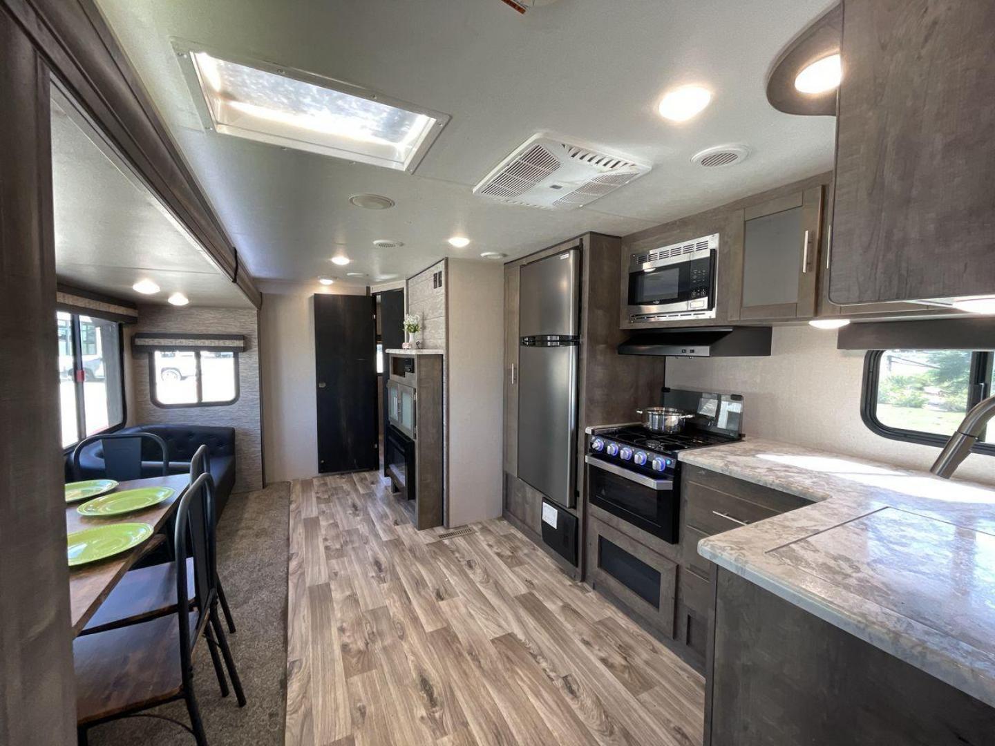 2020 KZ CONNECT 322BHK (4EZTL3221L7) , Length: 37.75 ft. | Dry Weight: 7,700 lbs. | Gross Weight: 8,800 lbs. | Slides: 2 transmission, located at 4319 N Main St, Cleburne, TX, 76033, (817) 678-5133, 32.385960, -97.391212 - The 2020 KZ Connect 322BHK boasts a modern and sleek exterior design, perfect for those seeking both style and functionality in a travel trailer. With a length of 37.75 ft. and a dry weight of 7,700 lbs., it offers a spacious yet manageable setup. The exterior features two large slides, significantl - Photo#11