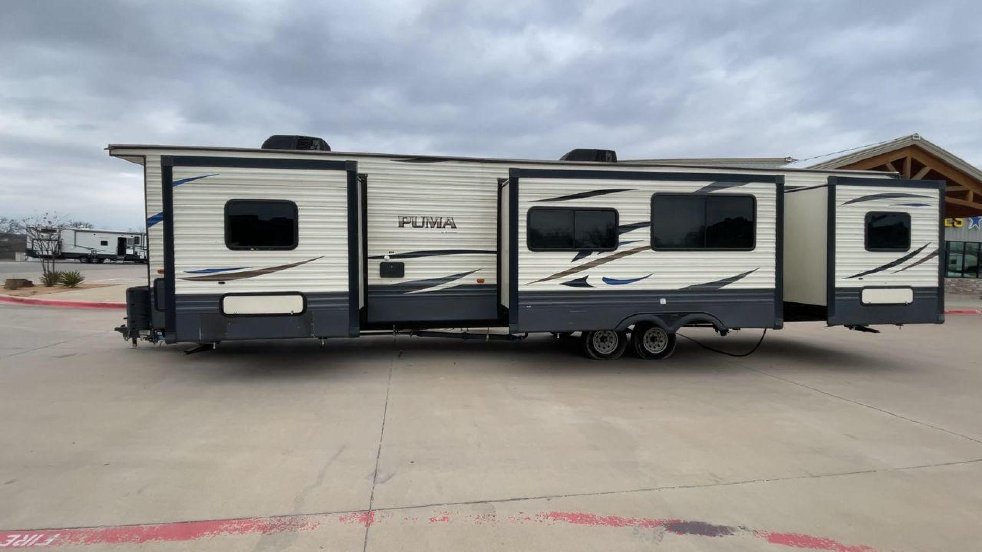 2020 NV DIGIL PUMA 38DBS - (4X4TPUP27LP) , Length: 41.92 ft | Dry Weight: 9,748 lbs. | Gross Weight: 11,522 lbs. | Slides: 3. transmission, located at 4319 N Main St, Cleburne, TX, 76033, (817) 678-5133, 32.385960, -97.391212 - With its impressive features and unbeatable price of $38,995, this RV is sure to make your road trip dreams come true. The 2020 Puma 38DBS is a spacious and stylish travel trailer designed for both comfort and functionality. Its exterior features a striking combination of cream and gray tones with s - Photo#6