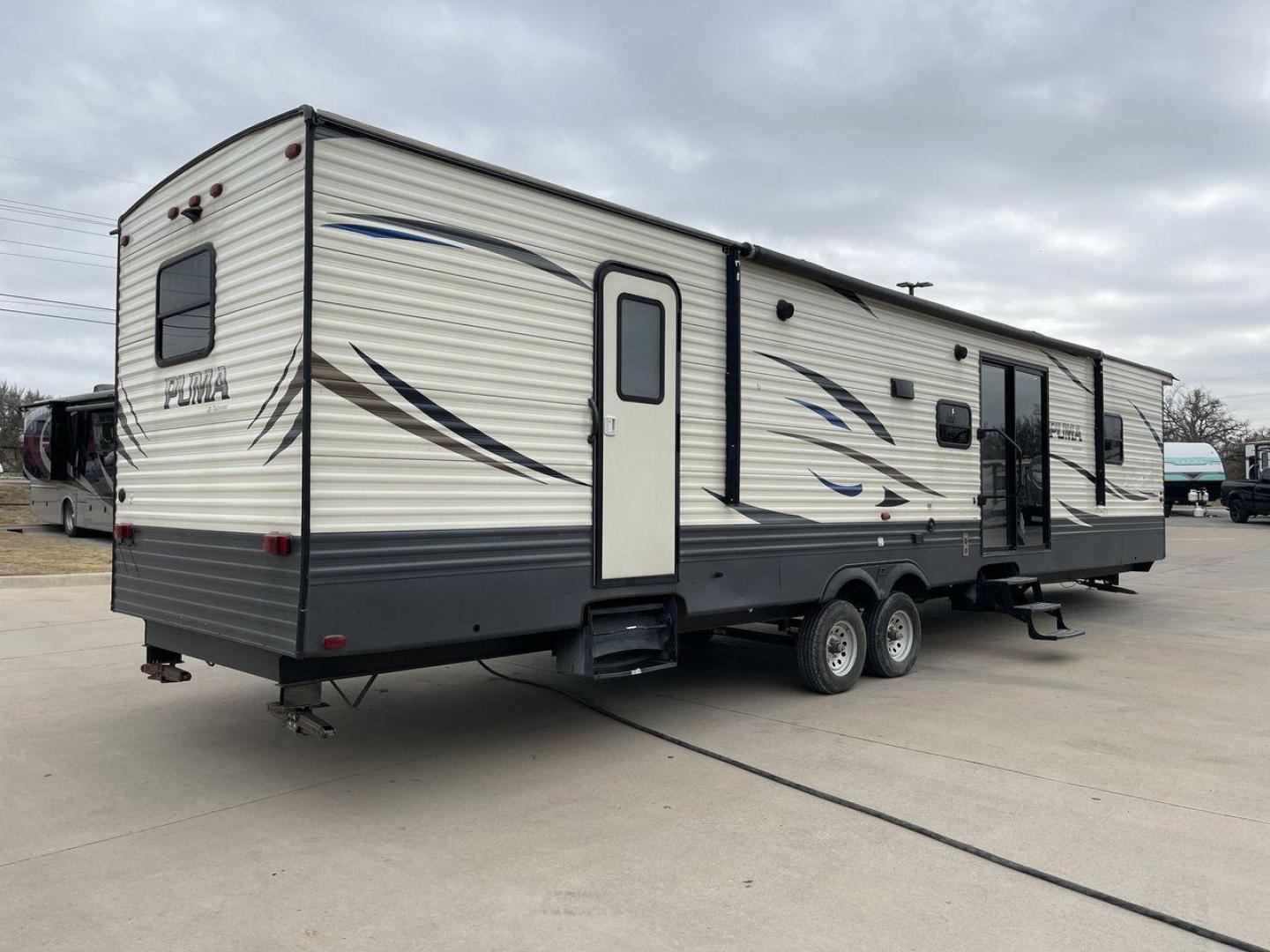 2020 NV DIGIL PUMA 38DBS - (4X4TPUP27LP) , Length: 41.92 ft | Dry Weight: 9,748 lbs. | Gross Weight: 11,522 lbs. | Slides: 3. transmission, located at 4319 N Main St, Cleburne, TX, 76033, (817) 678-5133, 32.385960, -97.391212 - With its impressive features and unbeatable price of $38,995, this RV is sure to make your road trip dreams come true. The 2020 Puma 38DBS is a spacious and stylish travel trailer designed for both comfort and functionality. Its exterior features a striking combination of cream and gray tones with s - Photo#24