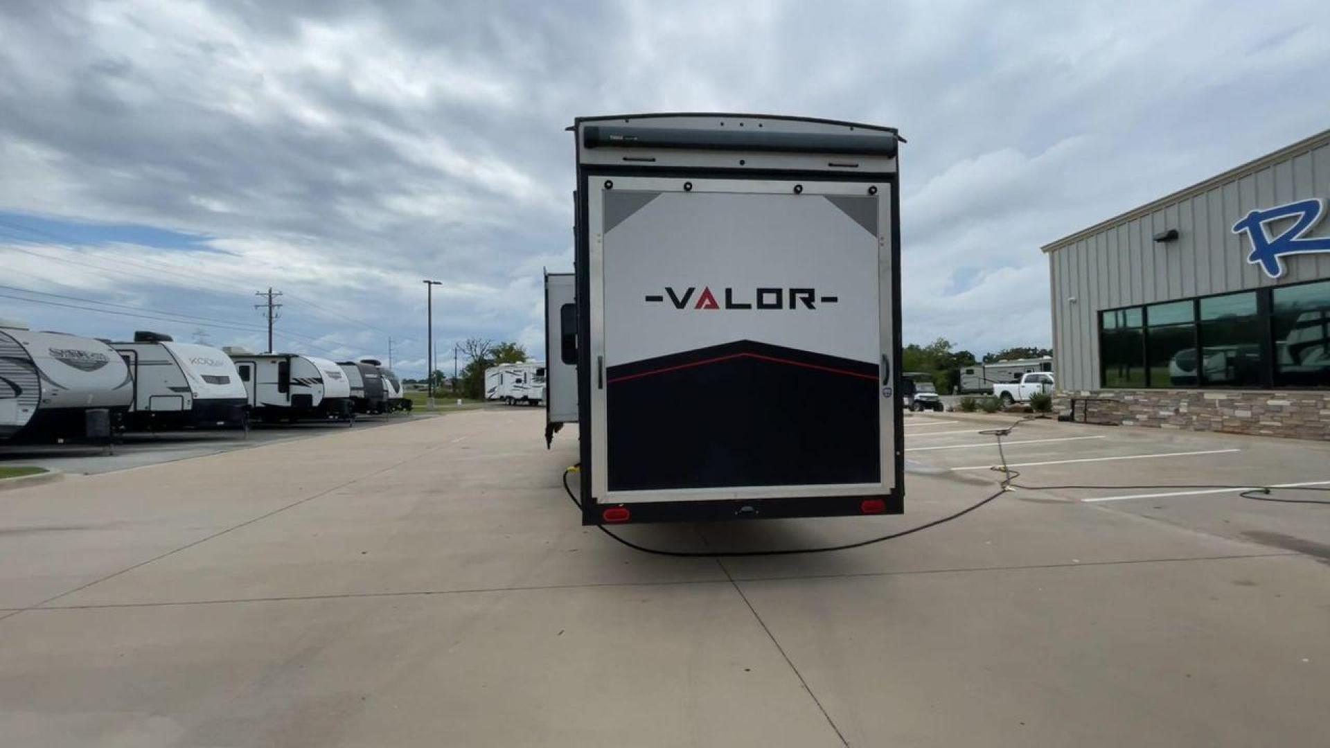 2021 ALLIANCE VALOR 42V13 (7M5FV4533MA) , Length: 44.08 ft. | Dry Weight: 16,064 lbs. | Gross Weight: 20,000 lbs. | Slides: 3 transmission, located at 4319 N Main St, Cleburne, TX, 76033, (817) 678-5133, 32.385960, -97.391212 - The Valor 42V13 features a striking modern exterior with clean lines, highlighted by its sleek black, white, and gray color scheme. The multiple slide-outs (3) enhance interior space, while the large windows offer plenty of natural light. The rear garage entry has a ramp door for easy loading of rec - Photo#8