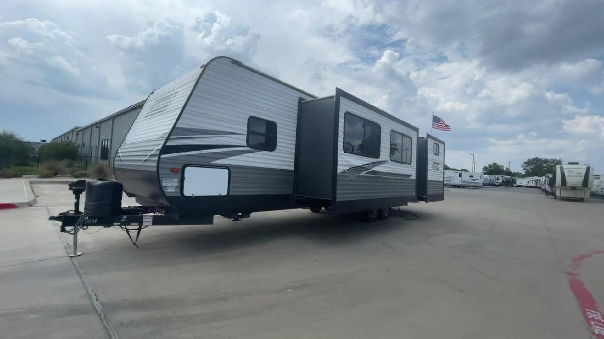 2021 WHITE DUTCHMEN COLEMAN 334BH (4YDT3342XMH) , Length: 37.25 ft. | Dry Weight: 7,806 lbs. | Slides: 2 transmission, located at 4319 N Main St, Cleburne, TX, 76033, (817) 678-5133, 32.385960, -97.391212 - The 2021 Dutchmen Coleman 334BH is a luxurious and spacious travel trailer designed to redefine your camping experience. Its exterior boasts a length of 37 feet, a width of 8 feet, and a dry weight of 7,806 lbs. The aluminum frame construction ensures durability and lightweight towing, while the hig - Photo#5