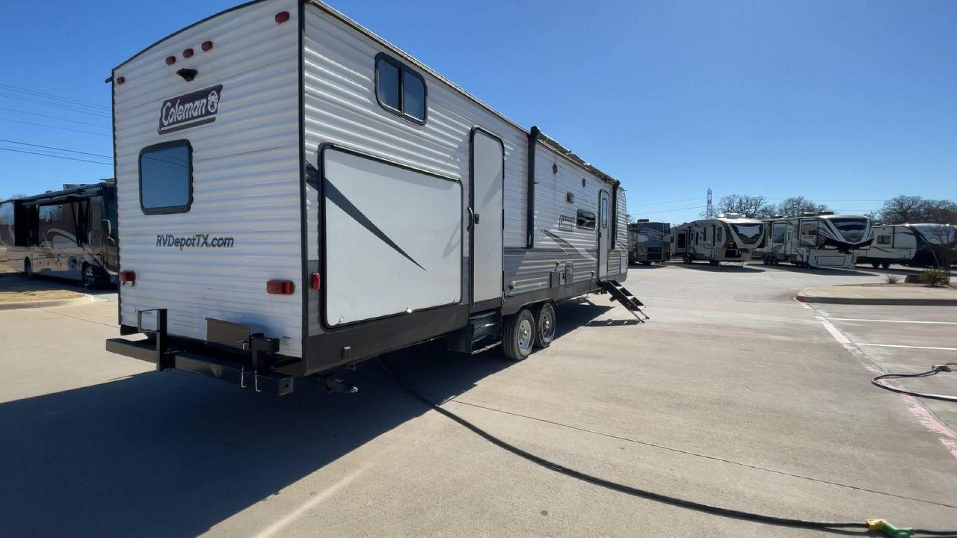 2021 WHITE DUTCHMEN COLEMAN 334BH (4YDT3342XMH) , Length: 37.25 ft. | Dry Weight: 7,806 lbs. | Slides: 2 transmission, located at 4319 N Main St, Cleburne, TX, 76033, (817) 678-5133, 32.385960, -97.391212 - The 2021 Dutchmen Coleman 334BH is a luxurious and spacious travel trailer designed to redefine your camping experience. Its exterior boasts a length of 37 feet, a width of 8 feet, and a dry weight of 7,806 lbs. The aluminum frame construction ensures durability and lightweight towing, while the hig - Photo#1