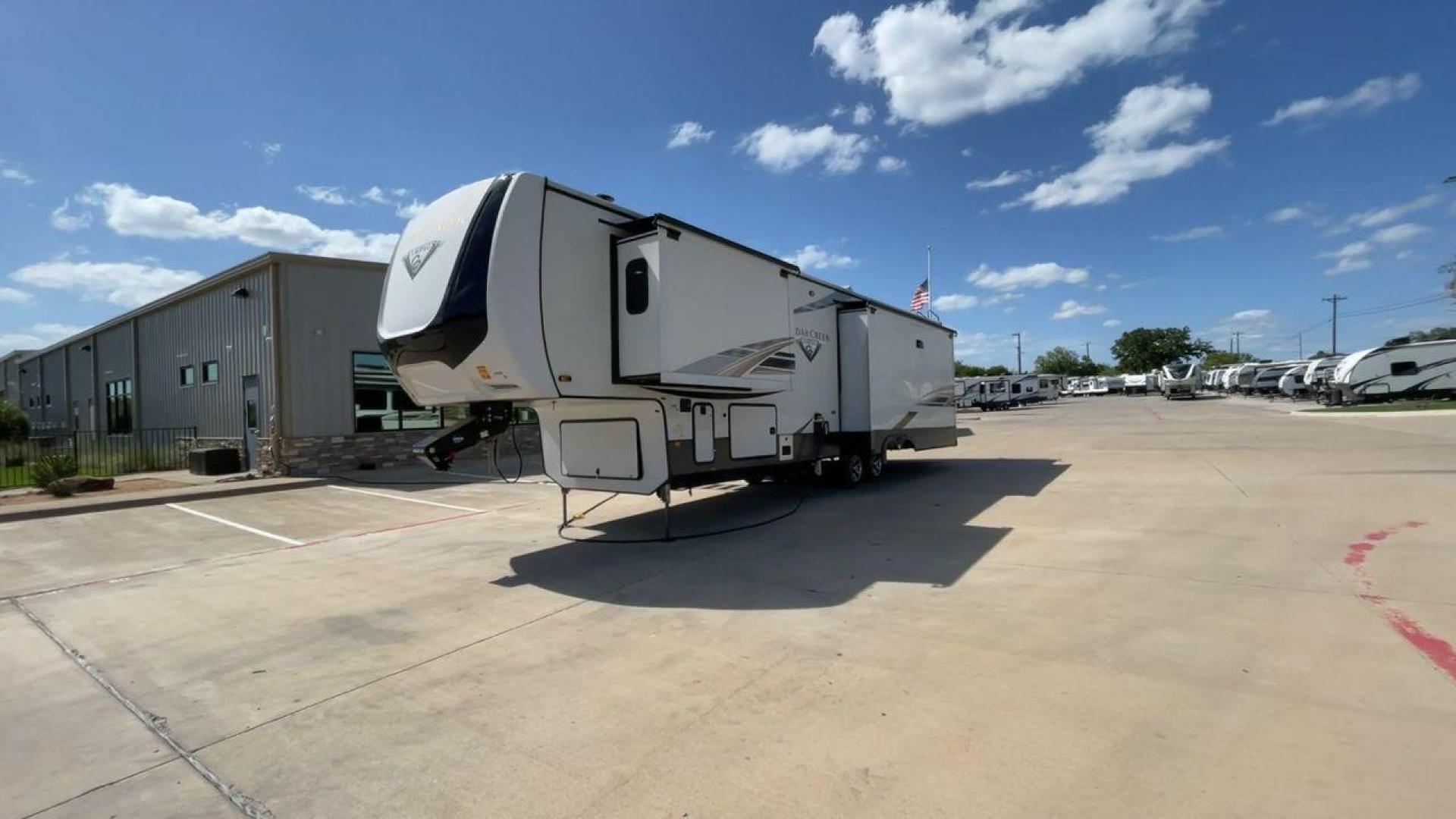 2021 FOREST RIVER CEDAR CREEK 38EL (4X4FCRP25MS) , Length: 39.75 ft. | Dry Weight: 14,429 lbs. | Gross Weight: 18,000 lbs. | Slides: 3 transmission, located at 4319 N Main St, Cleburne, TX, 76033, (817) 678-5133, 32.385960, -97.391212 - The 2021 Forest River Cedar Creek 38EL Champagne offers luxury and space for your next adventure. With a length of 39.75 feet and a dry weight of 14,429 lbs., this RV boasts three spacious slides to maximize living space. The exterior features sleek lines with large windows and a ladder at the rear, - Photo#5