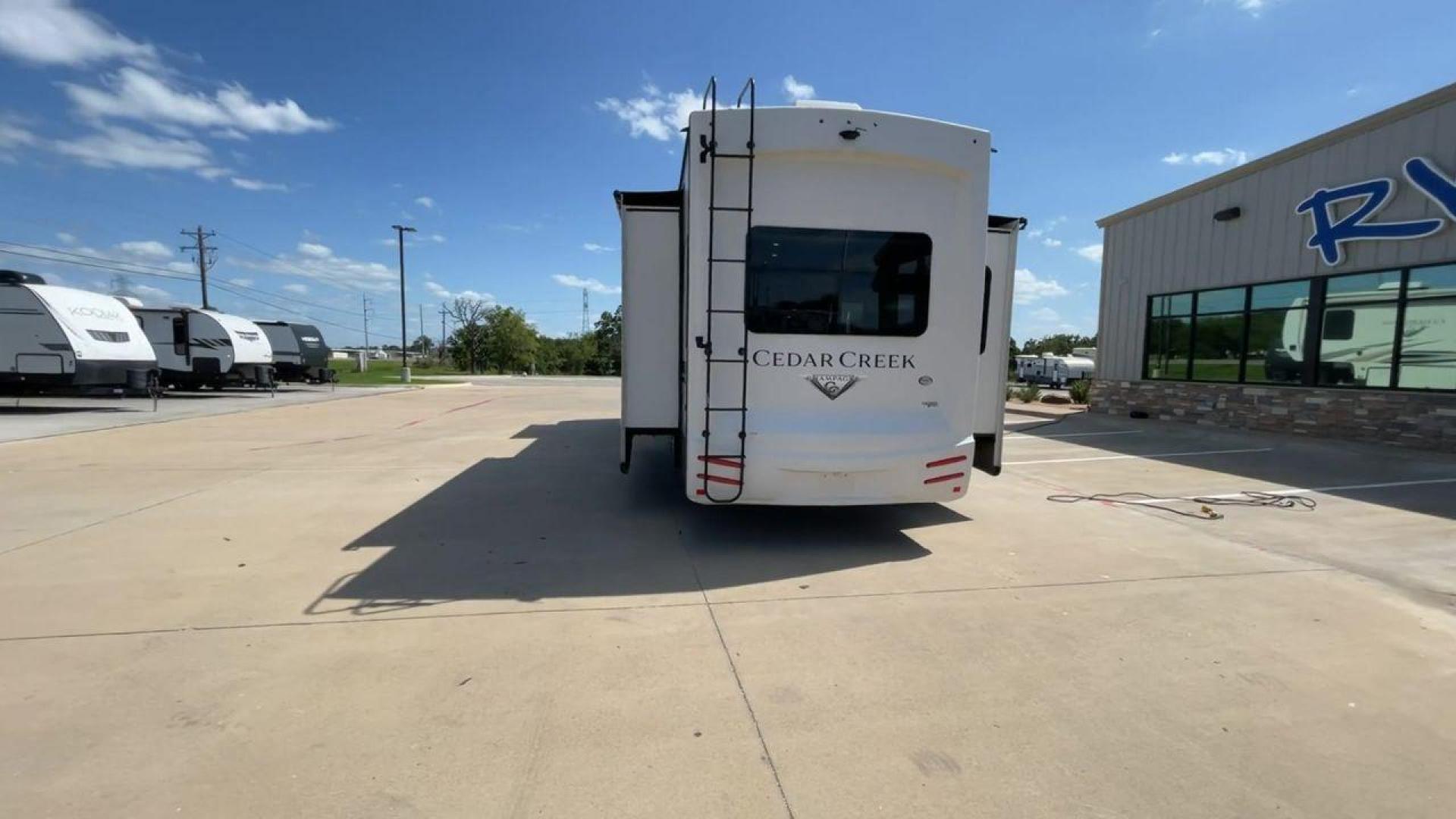 2021 FOREST RIVER CEDAR CREEK 38EL (4X4FCRP25MS) , Length: 39.75 ft. | Dry Weight: 14,429 lbs. | Gross Weight: 18,000 lbs. | Slides: 3 transmission, located at 4319 N Main St, Cleburne, TX, 76033, (817) 678-5133, 32.385960, -97.391212 - Photo#8