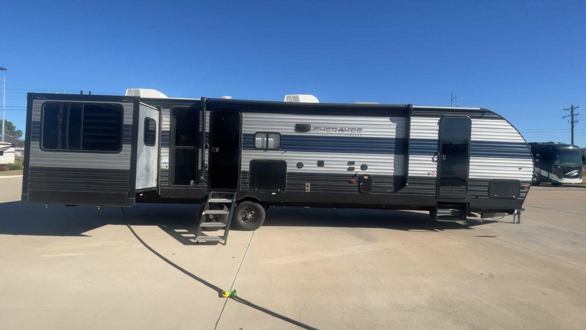 2021 FOREST RIVER CHEROKEE 306MM (4X4TCKG29MX) , Length: 39.92 ft. | Dry Weight: 8,578 lbs. | Gross Weight: 11,100 lbs. | Slides: 3 transmission, located at 4319 N Main St, Cleburne, TX, 76033, (817) 678-5133, 32.385960, -97.391212 - The 2021 Forest River Cherokee 306MM is a spacious and stylish travel trailer, ideal for families or couples who enjoy both relaxation and entertainment on the road. Its rear living area design and premium features make it a standout choice for extended adventures or weekend getaways. The dimensions - Photo#2