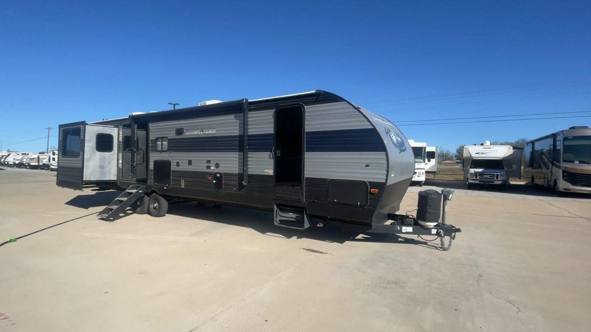 2021 FOREST RIVER CHEROKEE 306MM (4X4TCKG29MX) , Length: 39.92 ft. | Dry Weight: 8,578 lbs. | Gross Weight: 11,100 lbs. | Slides: 3 transmission, located at 4319 N Main St, Cleburne, TX, 76033, (817) 678-5133, 32.385960, -97.391212 - The 2021 Forest River Cherokee 306MM is a spacious and stylish travel trailer, ideal for families or couples who enjoy both relaxation and entertainment on the road. Its rear living area design and premium features make it a standout choice for extended adventures or weekend getaways. The dimensions - Photo#3