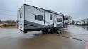 2021 FOREST RIVER IMPRESSION 320FL (5ZT3MPXB1MD) , Length: 40.17 ft | Dry Weight: 10,303 lbs | Gross Weight: 14,535 lbs | Slides: 4 transmission, located at 4319 N Main St, Cleburne, TX, 76033, (817) 678-5133, 32.385960, -97.391212 - The 2021 Forest River Impression 320FL fifth wheel RV is built for durability and style. Its sleek white fiberglass body is accented with bold black and blue graphics, giving it a modern and aerodynamic look. The front cap features a distinctive aerodynamic profile with the Impression logo prominent - Photo#1