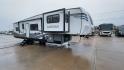 2021 FOREST RIVER IMPRESSION 320FL (5ZT3MPXB1MD) , Length: 40.17 ft | Dry Weight: 10,303 lbs | Gross Weight: 14,535 lbs | Slides: 4 transmission, located at 4319 N Main St, Cleburne, TX, 76033, (817) 678-5133, 32.385960, -97.391212 - The 2021 Forest River Impression 320FL fifth wheel RV is built for durability and style. Its sleek white fiberglass body is accented with bold black and blue graphics, giving it a modern and aerodynamic look. The front cap features a distinctive aerodynamic profile with the Impression logo prominent - Photo#3