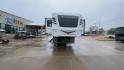 2021 FOREST RIVER IMPRESSION 320FL (5ZT3MPXB1MD) , Length: 40.17 ft | Dry Weight: 10,303 lbs | Gross Weight: 14,535 lbs | Slides: 4 transmission, located at 4319 N Main St, Cleburne, TX, 76033, (817) 678-5133, 32.385960, -97.391212 - The 2021 Forest River Impression 320FL fifth wheel RV is built for durability and style. Its sleek white fiberglass body is accented with bold black and blue graphics, giving it a modern and aerodynamic look. The front cap features a distinctive aerodynamic profile with the Impression logo prominent - Photo#4