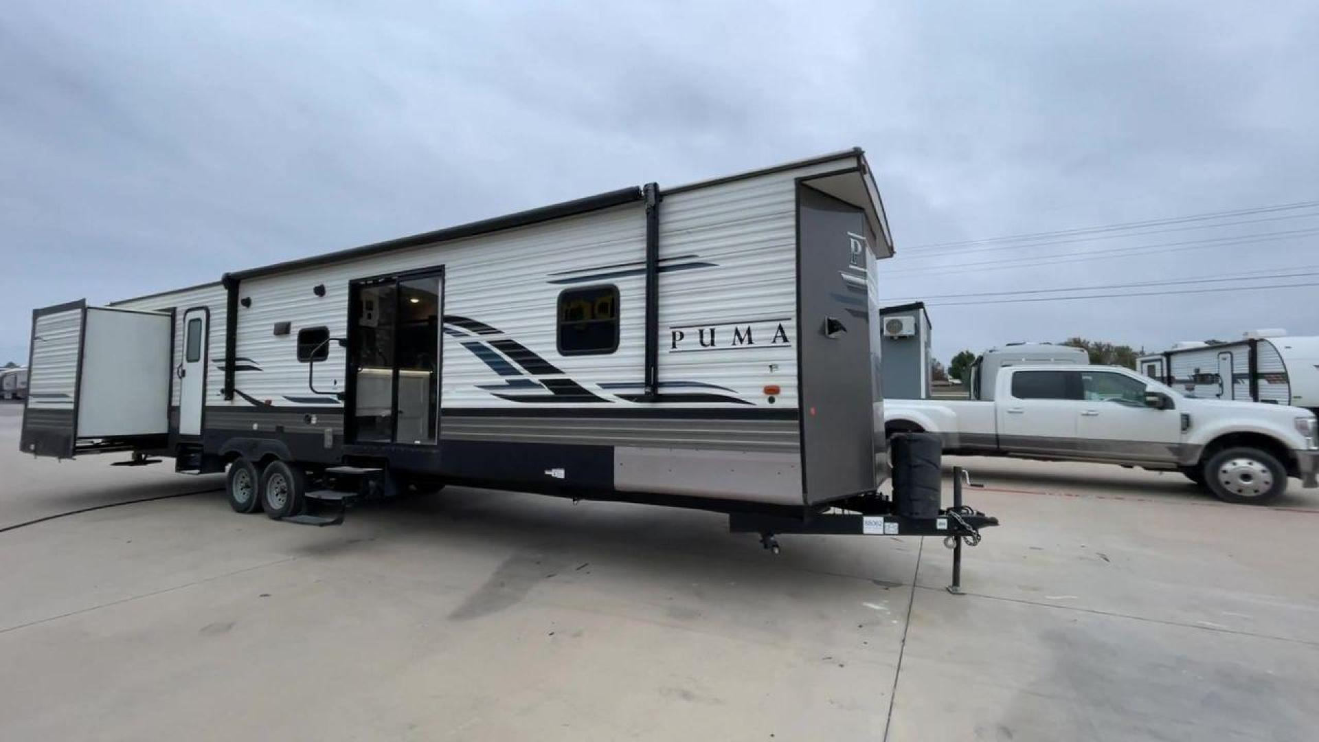 2021 FOREST RIVER PUMA 39PQB - (4X4TPUR24MP) , Length: 42.08 ft | Dry Weight: 10,709 lbs. lbs | Gross Weight: 13,413 lbs. | Slides: 4 transmission, located at 4319 N Main St, Cleburne, TX, 76033, (817) 678-5133, 32.385960, -97.391212 - Photo#3