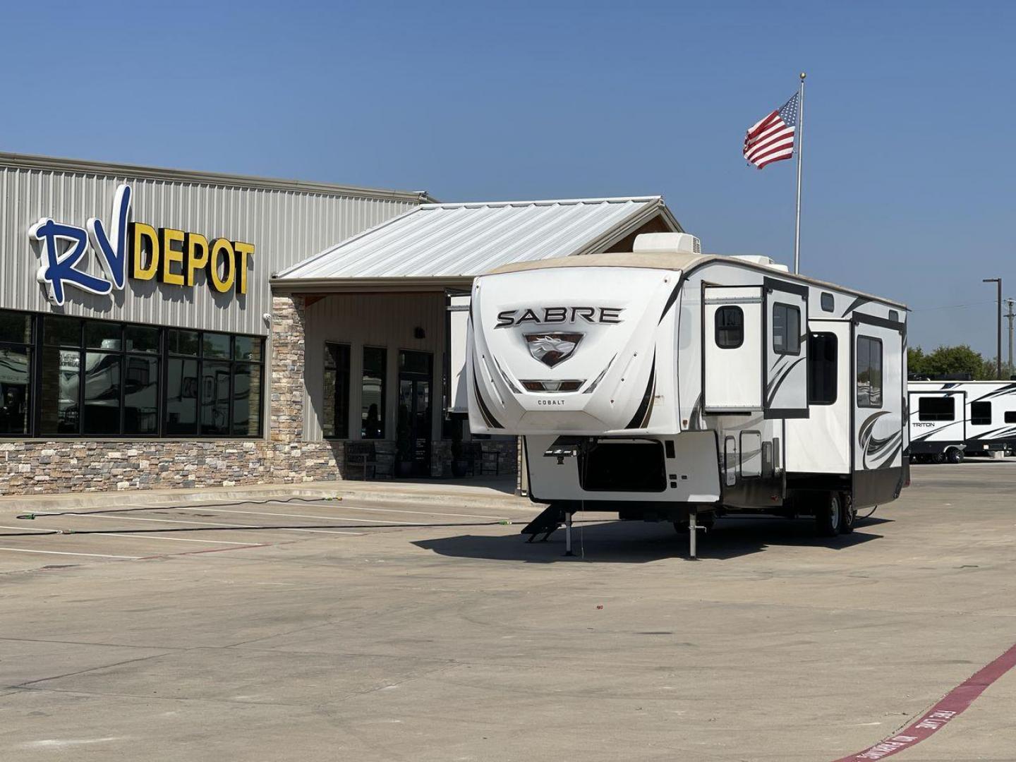 2021 FOREST RIVER SABRE 37FLL (5ZT3SR2B3M6) , Length: 42.75 ft. | Dry Weight: 11,918 lbs. | Slides: 4 transmission, located at 4319 N Main St, Cleburne, TX, 76033, (817) 678-5133, 32.385960, -97.391212 - The 2021 Forest River Sabre 37FLL is a large, luxurious fifth-wheel trailer that measures 42.75 feet in length and features four slide-outs. It has an aerodynamic front cap with the Sabre Cobalt logo and bold, modern graphics. The curved front end is designed to reduce wind drag when towing. The rea - Photo#0