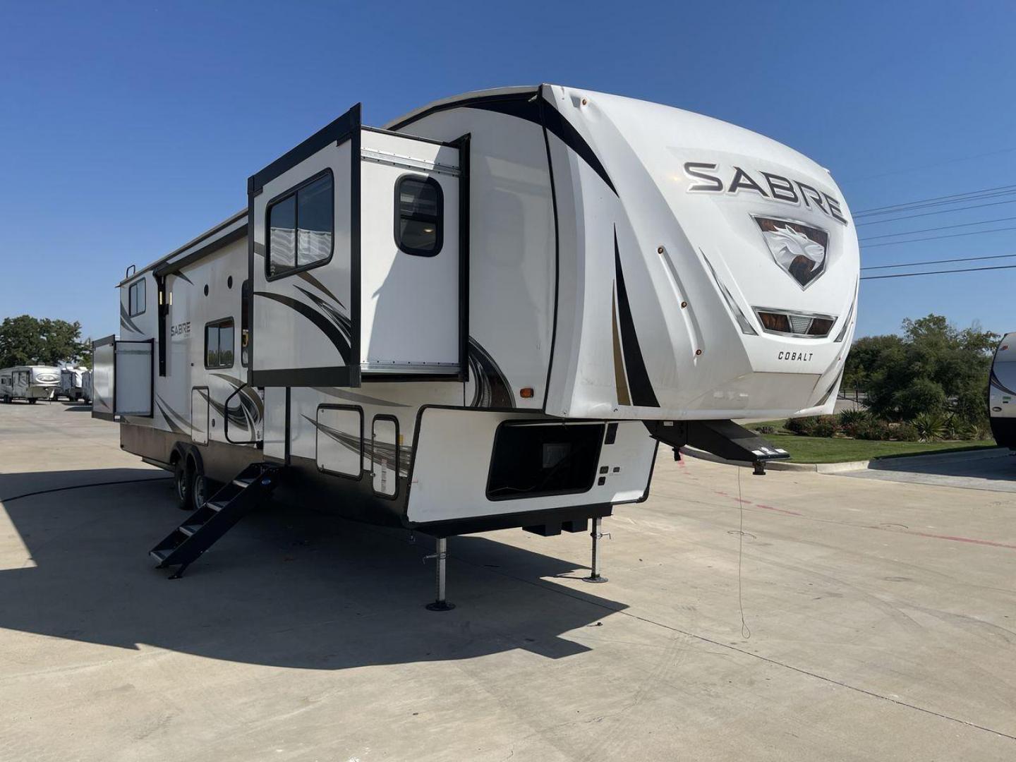 2021 FOREST RIVER SABRE 37FLL (5ZT3SR2B3M6) , Length: 42.75 ft. | Dry Weight: 11,918 lbs. | Slides: 4 transmission, located at 4319 N Main St, Cleburne, TX, 76033, (817) 678-5133, 32.385960, -97.391212 - The 2021 Forest River Sabre 37FLL is a large, luxurious fifth-wheel trailer that measures 42.75 feet in length and features four slide-outs. It has an aerodynamic front cap with the Sabre Cobalt logo and bold, modern graphics. The curved front end is designed to reduce wind drag when towing. The rea - Photo#23