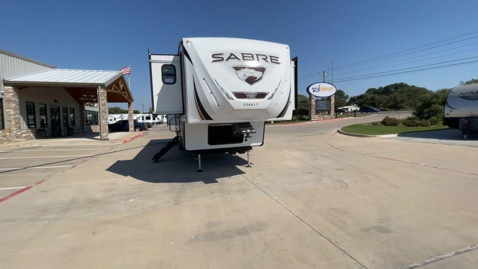 2021 FOREST RIVER SABRE 37FLL (5ZT3SR2B3M6) , Length: 42.75 ft. | Dry Weight: 11,918 lbs. | Slides: 4 transmission, located at 4319 N Main St, Cleburne, TX, 76033, (817) 678-5133, 32.385960, -97.391212 - The 2021 Forest River Sabre 37FLL is a large, luxurious fifth-wheel trailer that measures 42.75 feet in length and features four slide-outs. It has an aerodynamic front cap with the Sabre Cobalt logo and bold, modern graphics. The curved front end is designed to reduce wind drag when towing. The rea - Photo#4