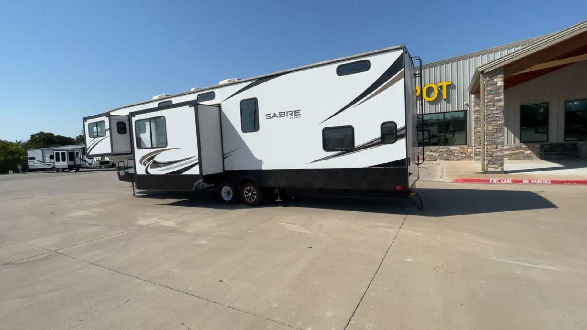 2021 FOREST RIVER SABRE 37FLL (5ZT3SR2B3M6) , Length: 42.75 ft. | Dry Weight: 11,918 lbs. | Slides: 4 transmission, located at 4319 N Main St, Cleburne, TX, 76033, (817) 678-5133, 32.385960, -97.391212 - The 2021 Forest River Sabre 37FLL is a large, luxurious fifth-wheel trailer that measures 42.75 feet in length and features four slide-outs. It has an aerodynamic front cap with the Sabre Cobalt logo and bold, modern graphics. The curved front end is designed to reduce wind drag when towing. The rea - Photo#7