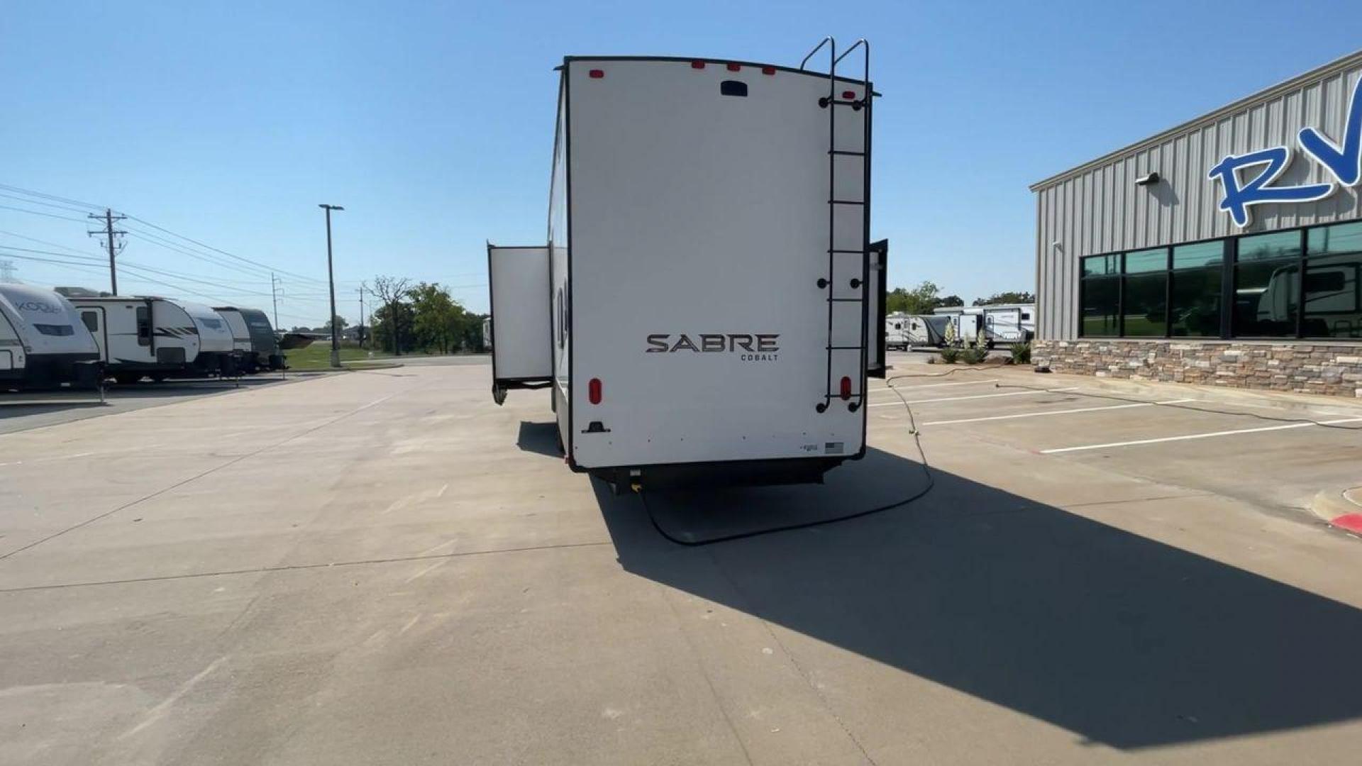 2021 FOREST RIVER SABRE 37FLL (5ZT3SR2B3M6) , Length: 42.75 ft. | Dry Weight: 11,918 lbs. | Slides: 4 transmission, located at 4319 N Main St, Cleburne, TX, 76033, (817) 678-5133, 32.385960, -97.391212 - The 2021 Forest River Sabre 37FLL is a large, luxurious fifth-wheel trailer that measures 42.75 feet in length and features four slide-outs. It has an aerodynamic front cap with the Sabre Cobalt logo and bold, modern graphics. The curved front end is designed to reduce wind drag when towing. The rea - Photo#8