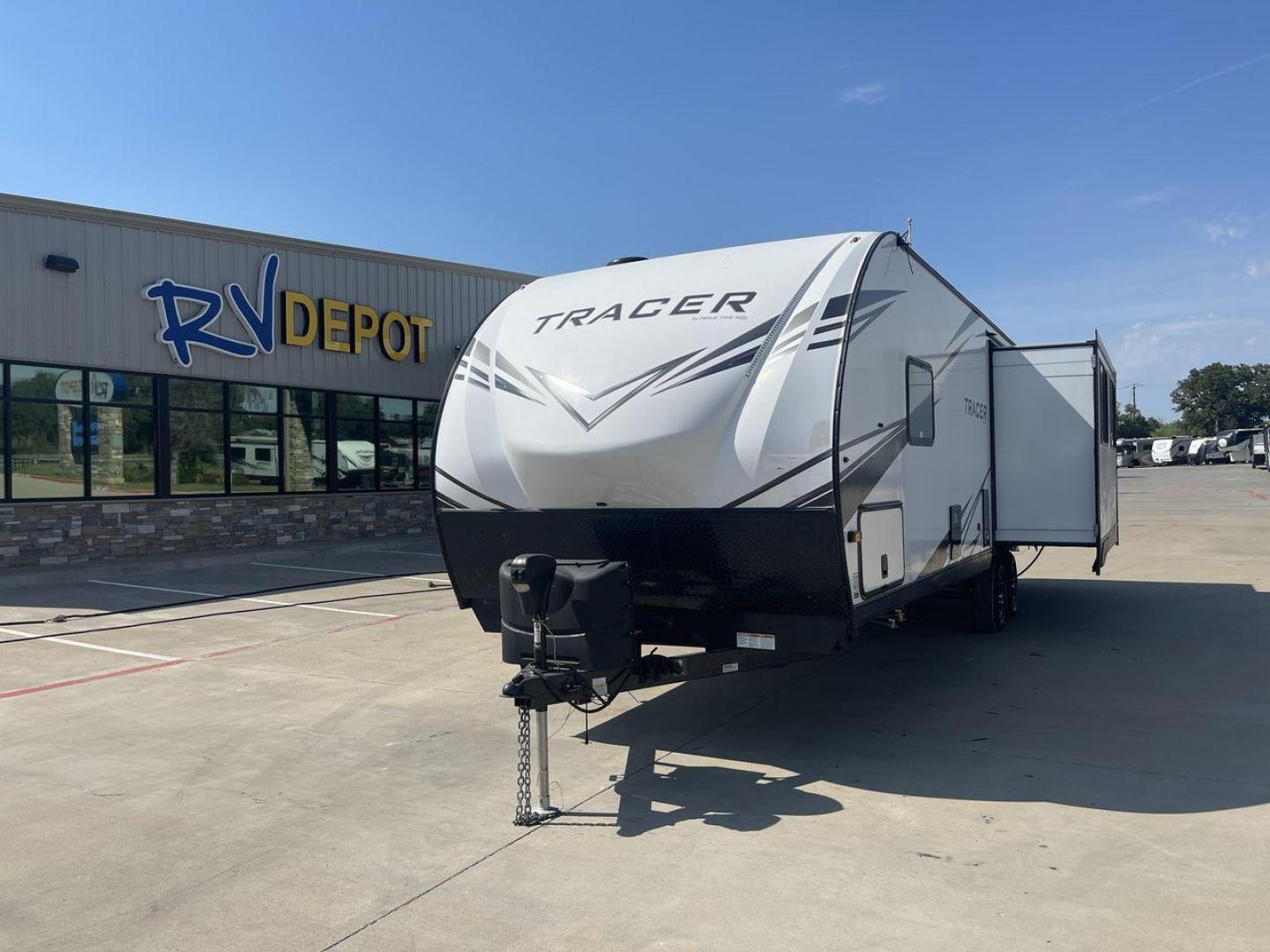 2021 FOREST RIVER TRACER 28RES (5ZT2TRTB1MB) , Length: 32.92 ft. | Dry Weight: 6,866 lbs. | Slides: 2 transmission, located at 4319 N Main St, Cleburne, TX, 76033, (817) 678-5133, 32.385960, -97.391212 - Measuring 32.92 feet in length with a dry weight of 6,866 lbs., the 2021 Forest River Tracer 28RES is both spacious and easy to tow. The sleek white exterior with black accents and Tracer branding gives the trailer a sharp and contemporary look. The dual slide-outs on one side help create more livin - Photo#0