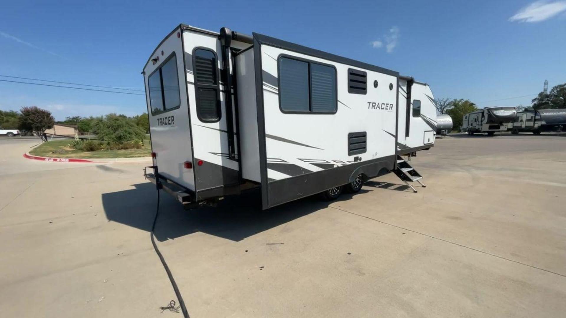 2021 FOREST RIVER TRACER 28RES (5ZT2TRTB1MB) , Length: 32.92 ft. | Dry Weight: 6,866 lbs. | Slides: 2 transmission, located at 4319 N Main St, Cleburne, TX, 76033, (817) 678-5133, 32.385960, -97.391212 - Measuring 32.92 feet in length with a dry weight of 6,866 lbs., the 2021 Forest River Tracer 28RES is both spacious and easy to tow. The sleek white exterior with black accents and Tracer branding gives the trailer a sharp and contemporary look. The dual slide-outs on one side help create more livin - Photo#1