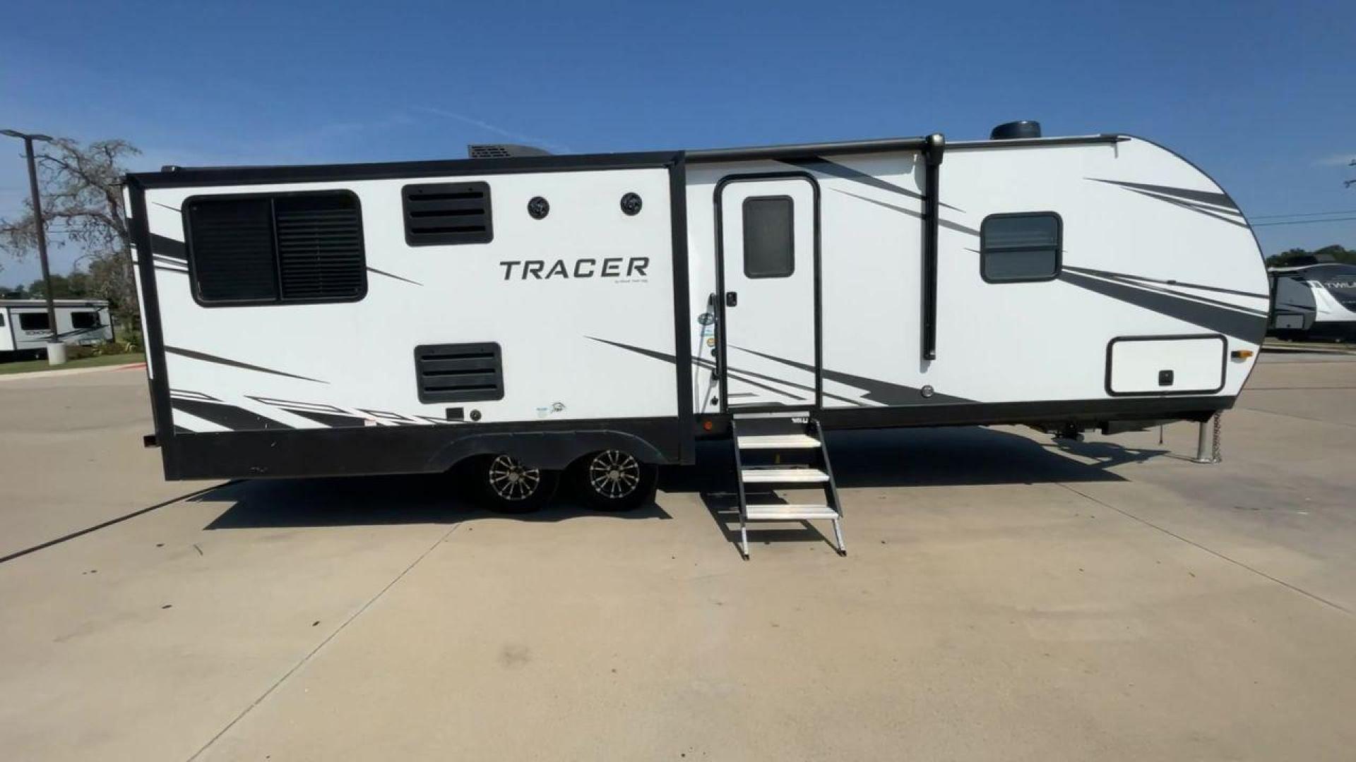 2021 FOREST RIVER TRACER 28RES (5ZT2TRTB1MB) , Length: 32.92 ft. | Dry Weight: 6,866 lbs. | Slides: 2 transmission, located at 4319 N Main St, Cleburne, TX, 76033, (817) 678-5133, 32.385960, -97.391212 - Measuring 32.92 feet in length with a dry weight of 6,866 lbs., the 2021 Forest River Tracer 28RES is both spacious and easy to tow. The sleek white exterior with black accents and Tracer branding gives the trailer a sharp and contemporary look. The dual slide-outs on one side help create more livin - Photo#2