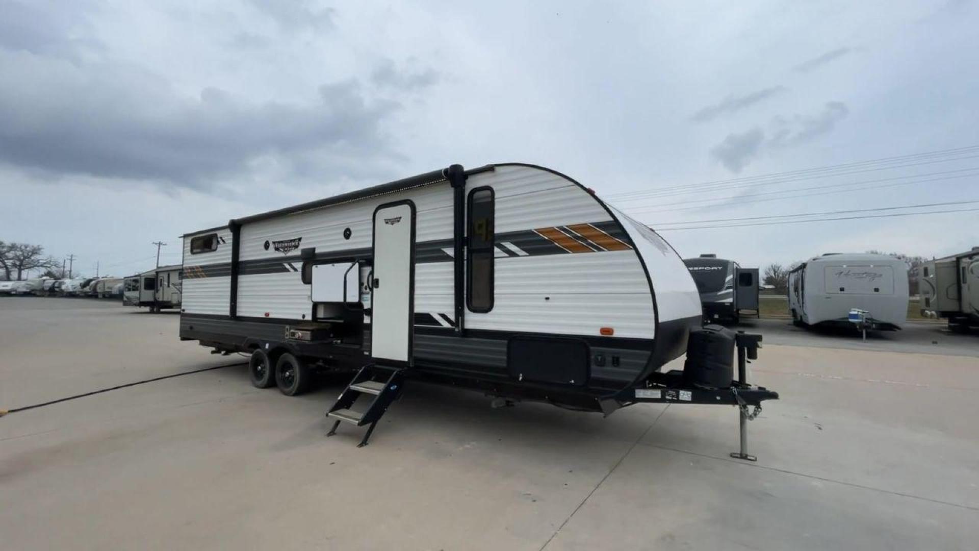 2021 FOREST RIVER WILDWOOD 28VBXL (4X4TWDD25M7) , Length: 33.33 ft. | Dry Weight: 6,486 lbs. | Slides: 1 transmission, located at 4319 N Main St, Cleburne, TX, 76033, (817) 678-5133, 32.385960, -97.391212 - Explore the ideal mix of comfort and family-friendly excitement with the 2021 Forest River Wildwood 28VBXL. This 33-foot travel trailer offers a spacious and versatile interior perfect for families and friends looking to create lasting camping memories. This Wildwood 28VBXL model showcases a distinc - Photo#3