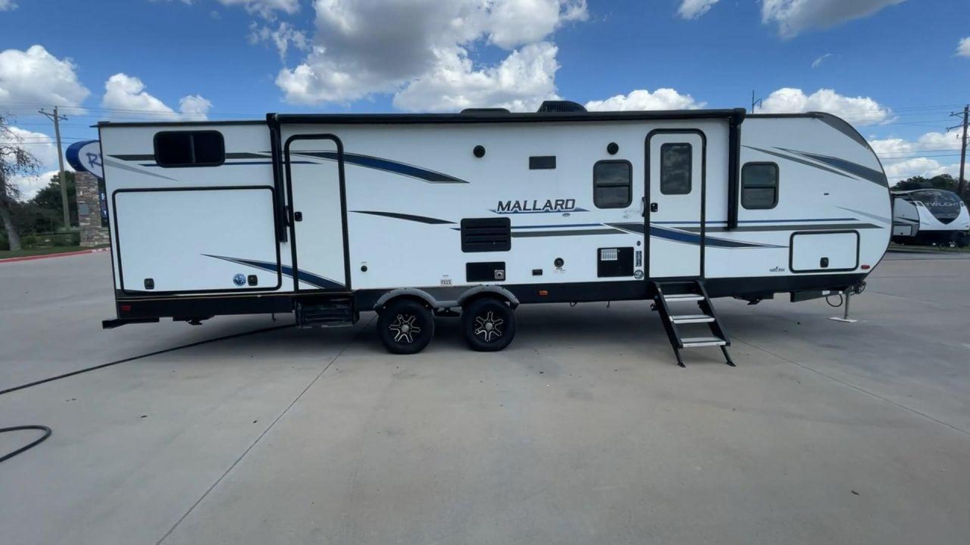 2021 HEARTLAND MALLARD M32 (5SFNB3524ME) , Length: 34.79 ft. | Dry Weight: 6,926 lbs. | Gross Weight: 8,600 lbs. | Slides: 2 transmission, located at 4319 N Main St, Cleburne, TX, 76033, (817) 678-5133, 32.385960, -97.391212 - The 2021 Heartland Mallard M32 is a sleek and modern travel trailer with a length of 34.79 feet and a dry weight of 6,926 lbs. The gross weight is 8,600 lbs, making it easily towable by larger SUVs and trucks. It features a clean, white exterior with stylish blue and black decals that run along the - Photo#2