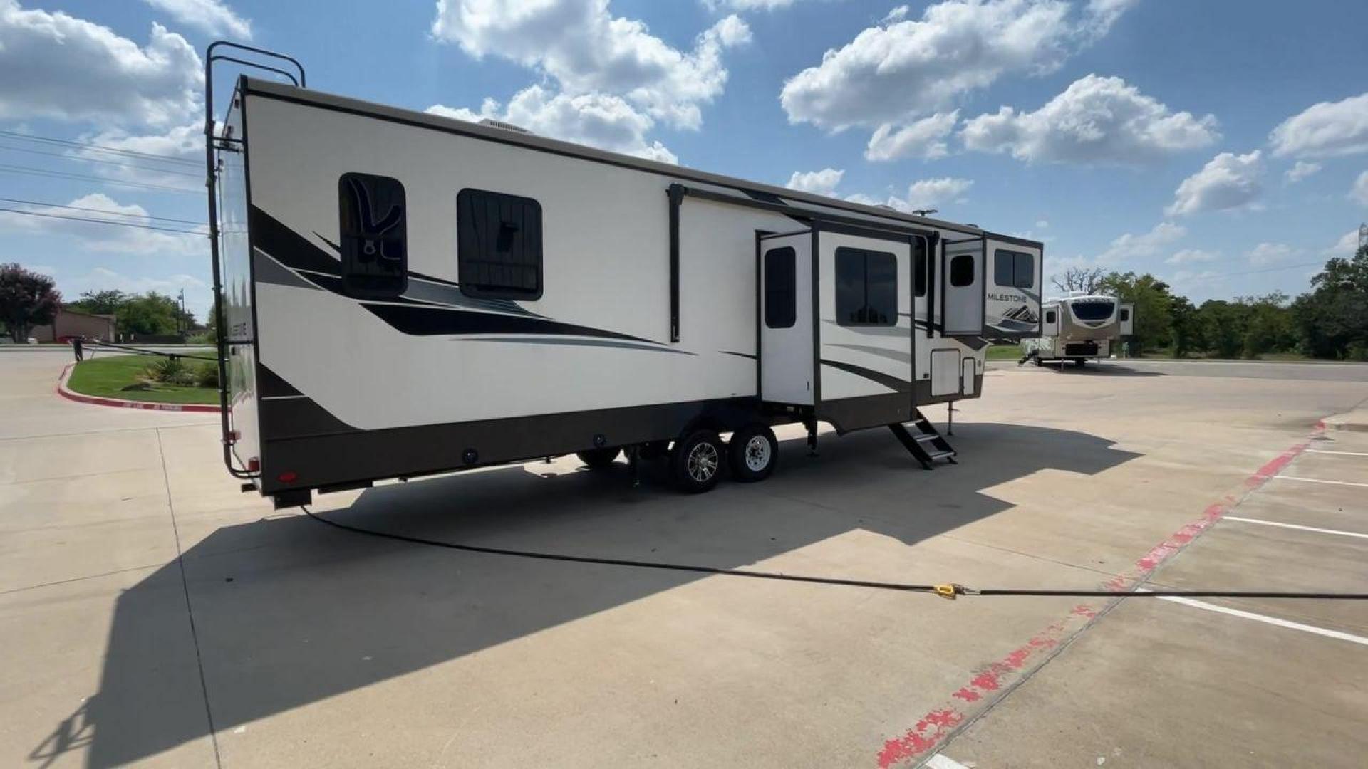 2021 HEARTLAND MILESTONE 379FLML (5SFMG4426ME) , Length: 44.17 ft. | Dry Weight: 12,600 lbs. | Gross Weight: 15,000 lbs. | Slides: 5 transmission, located at 4319 N Main St, Cleburne, TX, 76033, (817) 678-5133, 32.385960, -97.391212 - The 2021 Heartland Milestone 379FLML is 44.17 feet in length and has a dry weight of 12,600 pounds, with a gross weight capability of 15,000 pounds. This type of RV is intended for extended living and luxurious travel. It comes with five slide-outs that dramatically increase interior space, creating - Photo#1