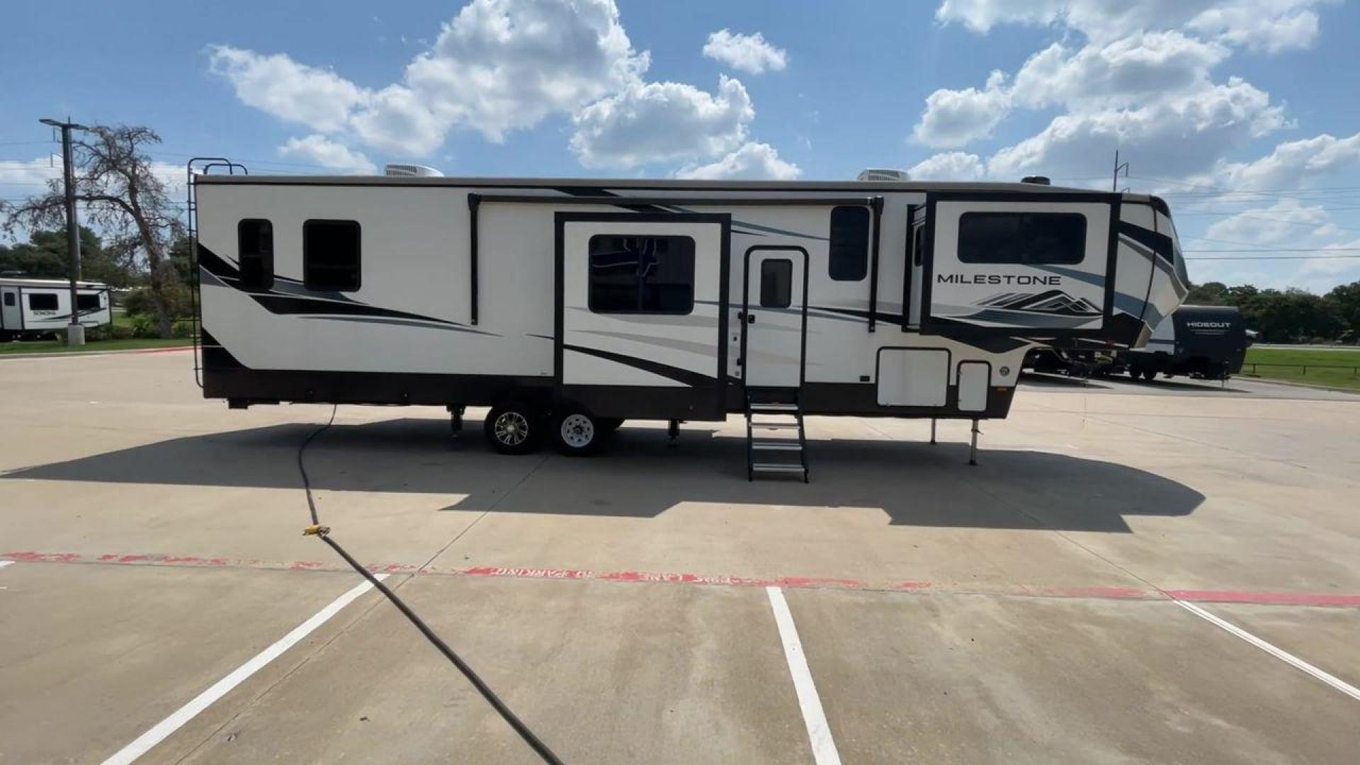 2021 HEARTLAND MILESTONE 379FLML (5SFMG4426ME) , Length: 44.17 ft. | Dry Weight: 12,600 lbs. | Gross Weight: 15,000 lbs. | Slides: 5 transmission, located at 4319 N Main St, Cleburne, TX, 76033, (817) 678-5133, 32.385960, -97.391212 - The 2021 Heartland Milestone 379FLML is 44.17 feet in length and has a dry weight of 12,600 pounds, with a gross weight capability of 15,000 pounds. This type of RV is intended for extended living and luxurious travel. It comes with five slide-outs that dramatically increase interior space, creating - Photo#2