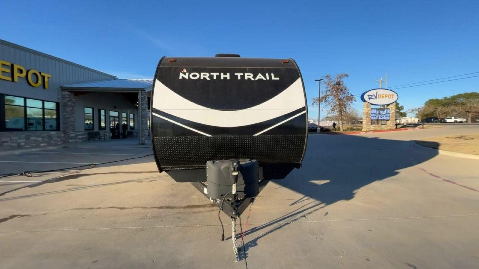 2021 HEARTLAND NORTH TRAIL 33BHDS (5SFNB3827ME) , Length: 37.62 ft | Dry Weight: 8,015 lbs | Gross Weight: 9,600 lbs | Slides: 3 transmission, located at 4319 N Main St, Cleburne, TX, 76033, (817) 678-5133, 32.385960, -97.391212 - The 2021 Heartland North Trail 33BHDS is a family-friendly travel trailer that combines modern amenities with spacious living. This 37-foot model features three slide-outs, providing ample room for the master bedroom with a queen-size bed and dual wardrobes, while the bunkhouse offers a cozy retreat - Photo#4