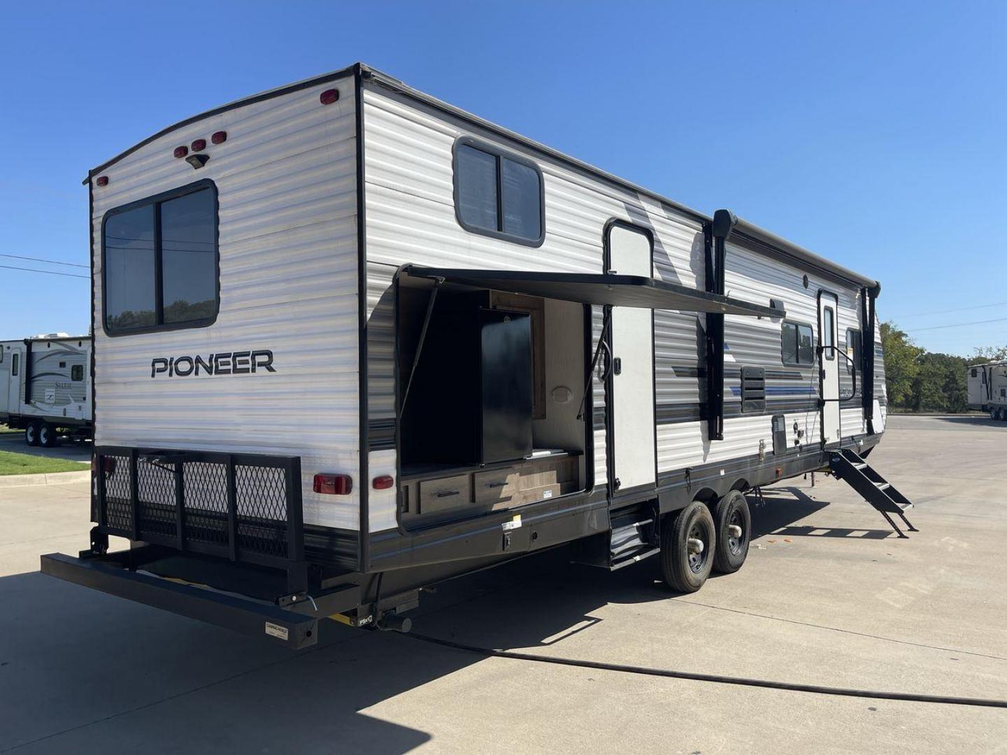 2021 HEARTLAND PIONEER DS320 (5SFPB3725ME) , Length: 37.42 ft. | Dry Weight: 7,696 lbs. | Gross Weight: 9,000 lbs. | Slides: 2 transmission, located at 4319 N Main St, Cleburne, TX, 76033, (817) 678-5133, 32.385960, -97.391212 - The 2021 Heartland Pioneer DS320 is a spacious and well-designed travel trailer, perfect for large families or group trips. Measuring 37.42 feet in length with a dry weight of 7,696 lbs. and a gross weight of 9,000 lbs., this unit is built for comfortable travel while maintaining a manageable towing - Photo#25