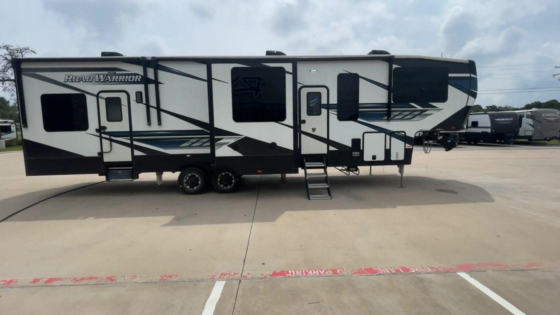 2021 HEARTLAND ROAD WARRIOR 351 (5SFCG4128ME) , Length: 41.5 ft. | Dry Weight: 14,530 lbs. | Gross Weight: 17,250 lbs. | Slides: 3 transmission, located at 4319 N Main St, Cleburne, TX, 76033, (817) 678-5133, 32.385960, -97.391212 - The 2021 Heartland Road Warrior 351 is a stunning and spacious toy hauler that combines luxury and practicality for adventurers. With an impressive length of 41.5 feet, it offers ample space for both relaxation and adventure. The unit features three slides, maximizing the living area for comfort. In - Photo#2