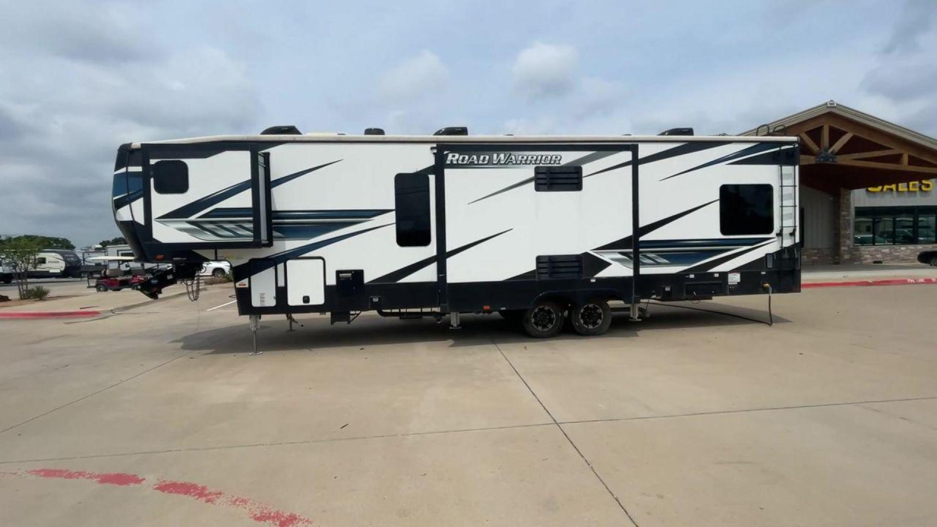 2021 HEARTLAND ROAD WARRIOR 351 (5SFCG4128ME) , Length: 41.5 ft. | Dry Weight: 14,530 lbs. | Gross Weight: 17,250 lbs. | Slides: 3 transmission, located at 4319 N Main St, Cleburne, TX, 76033, (817) 678-5133, 32.385960, -97.391212 - The 2021 Heartland Road Warrior 351 is a stunning and spacious toy hauler that combines luxury and practicality for adventurers. With an impressive length of 41.5 feet, it offers ample space for both relaxation and adventure. The unit features three slides, maximizing the living area for comfort. In - Photo#6