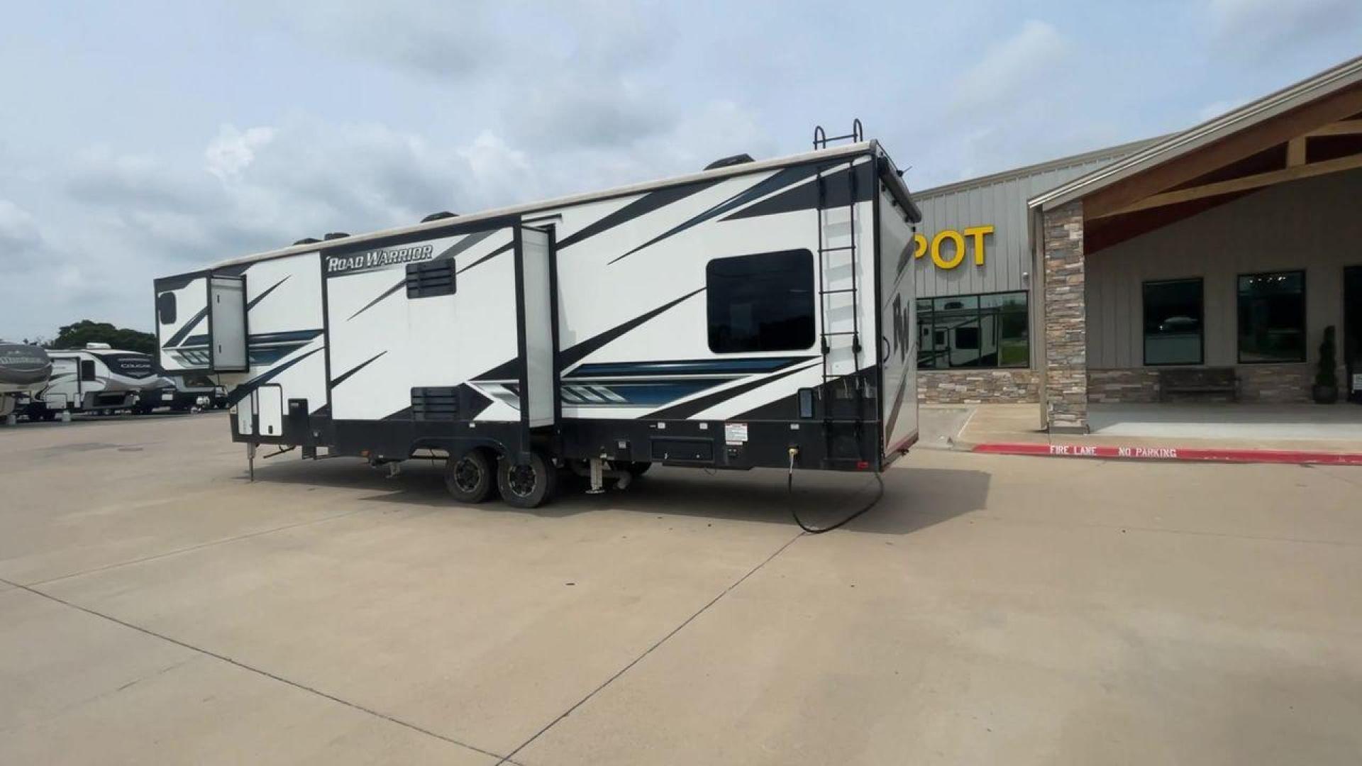 2021 HEARTLAND ROAD WARRIOR 351 (5SFCG4128ME) , Length: 41.5 ft. | Dry Weight: 14,530 lbs. | Gross Weight: 17,250 lbs. | Slides: 3 transmission, located at 4319 N Main St, Cleburne, TX, 76033, (817) 678-5133, 32.385960, -97.391212 - The 2021 Heartland Road Warrior 351 is a stunning and spacious toy hauler that combines luxury and practicality for adventurers. With an impressive length of 41.5 feet, it offers ample space for both relaxation and adventure. The unit features three slides, maximizing the living area for comfort. In - Photo#7