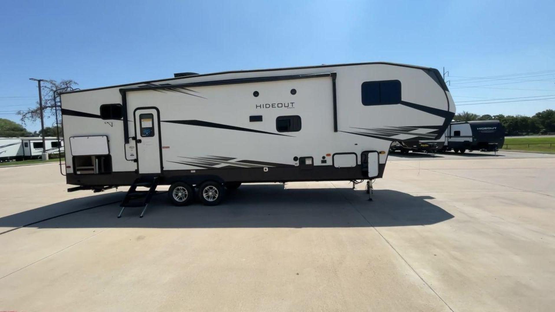 2021 KEYSTONE HIDEOUT 301DBS (4YDF30120M1) , Length: 34.17 ft. | Dry Weight: 8,669 lbs. | Gross Weight: 12,100 lbs. | Slides: 1 transmission, located at 4319 N Main St, Cleburne, TX, 76033, (817) 678-5133, 32.385960, -97.391212 - Photo#2