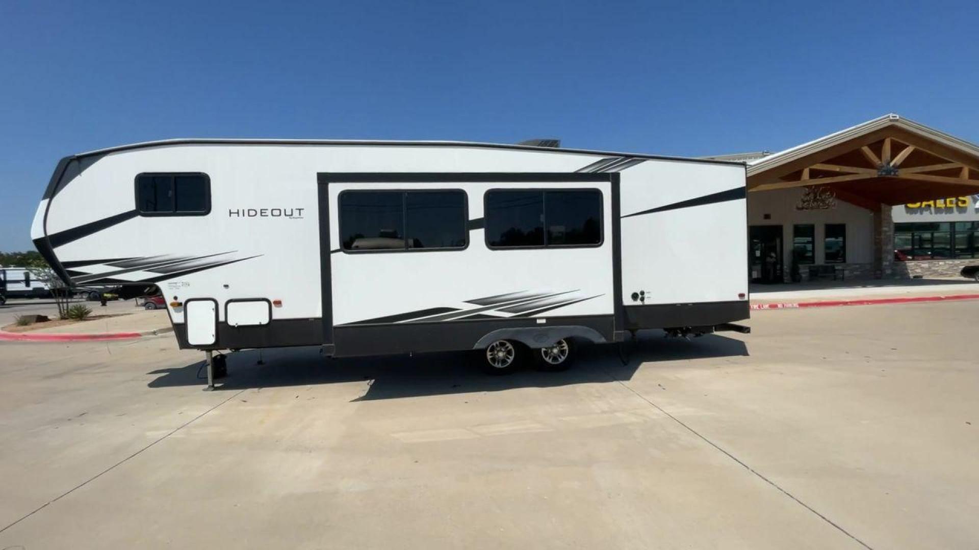 2021 KEYSTONE HIDEOUT 301DBS (4YDF30120M1) , Length: 34.17 ft. | Dry Weight: 8,669 lbs. | Gross Weight: 12,100 lbs. | Slides: 1 transmission, located at 4319 N Main St, Cleburne, TX, 76033, (817) 678-5133, 32.385960, -97.391212 - Photo#6